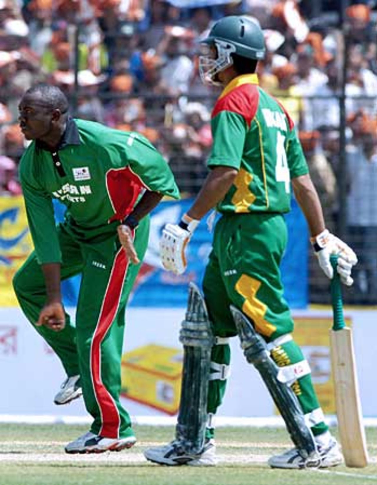Steve Tikolo sends down another delivery, watched by Mohammad Ashraful, 
Bangladesh v Kenya, 3rd ODI, Fatullah, March 23 2006