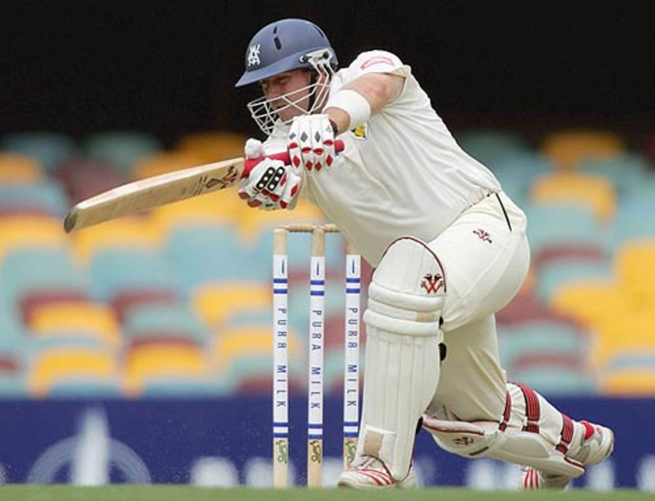 Jason Arnberger leans into a cover drive, Queensland v Victoria, Pura Cup final, 1st day, Brisbane, March 24, 2006