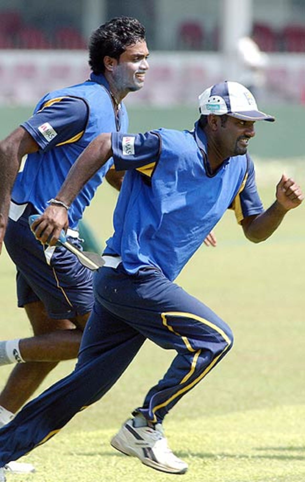 Muttiah Muralitharan and Dilhara Fernando check out who's faster, Colombo, March 24 2006