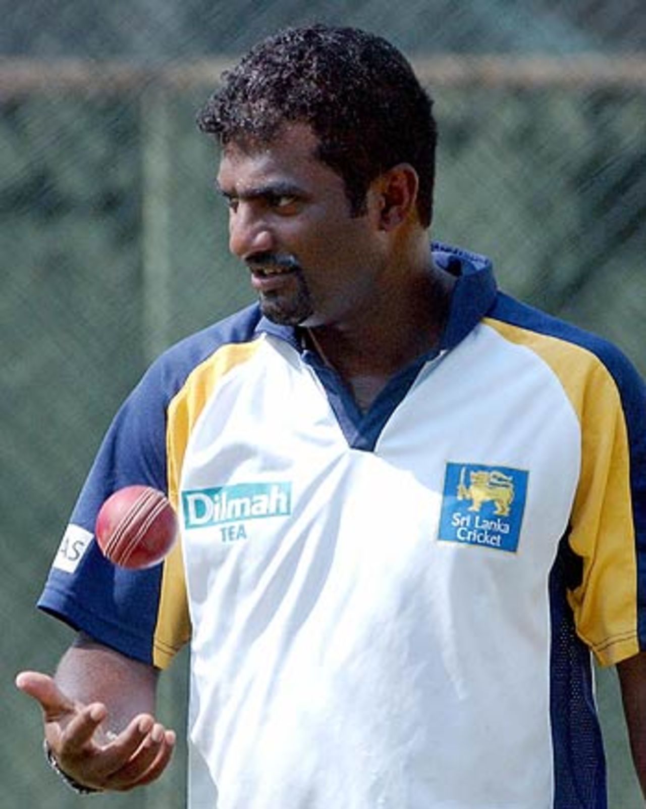 Muttiah Muralitharan walks back to his mark during a net session, Colombo, March 24 2006