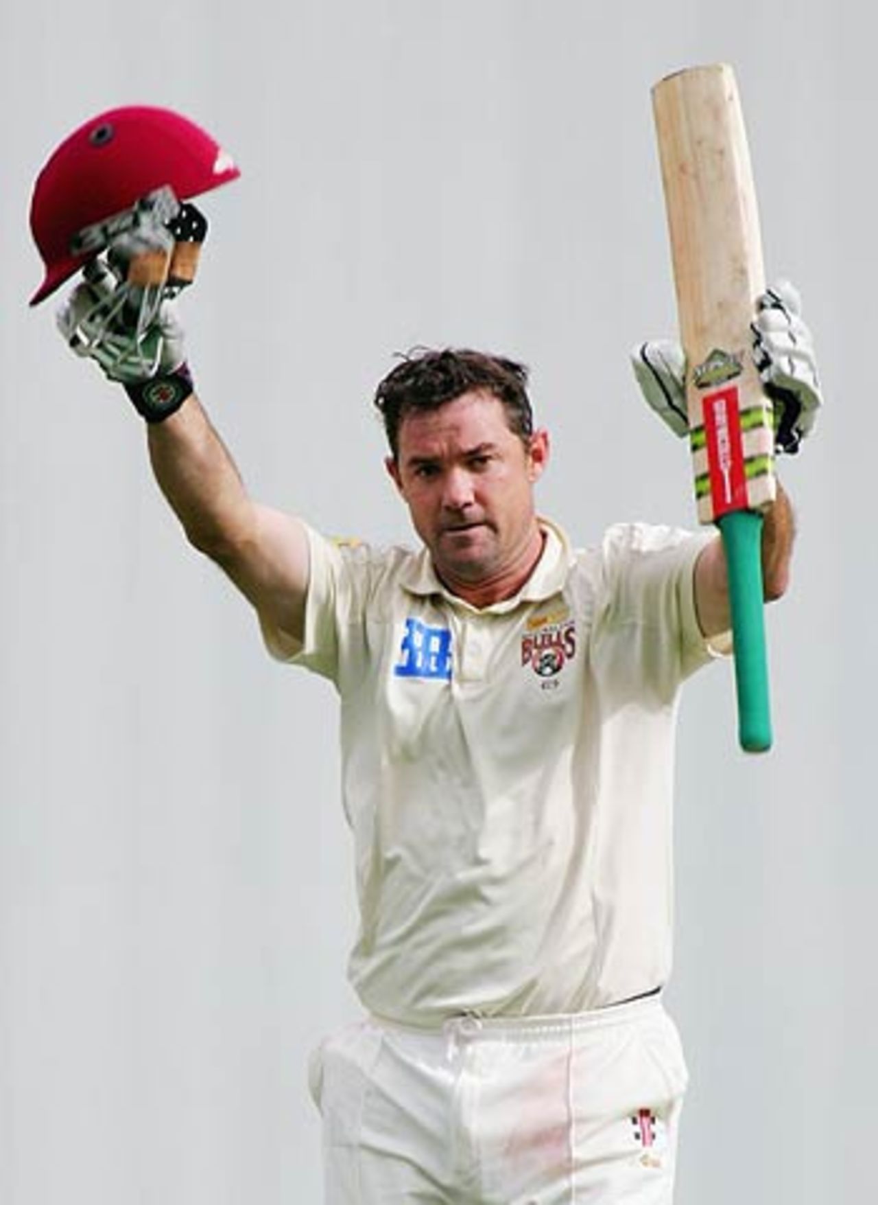 Jimmy Maher celebrates his hundred against Victoria on the second day of the Pura Cup final at the Gabba, Queensland v Victoria, Pura Cup final, 2nd day, Brisbane, March 25, 2006