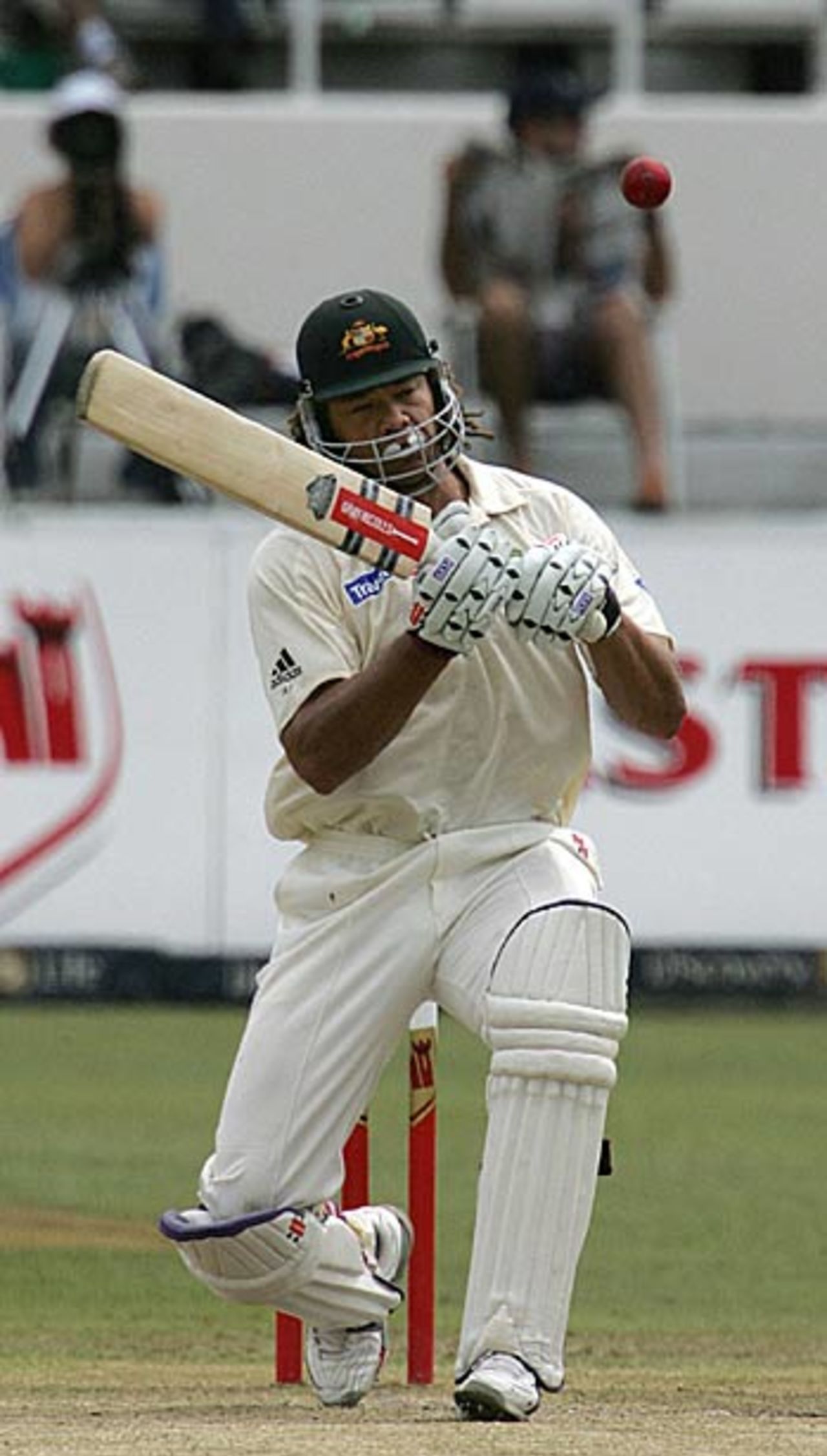 Andrew Symonds ducks under another short one; he struggled to score at his usual pace on the second morning in tough conditions, South Africa v Australia, 2nd Test, Durban, March 25, 2006