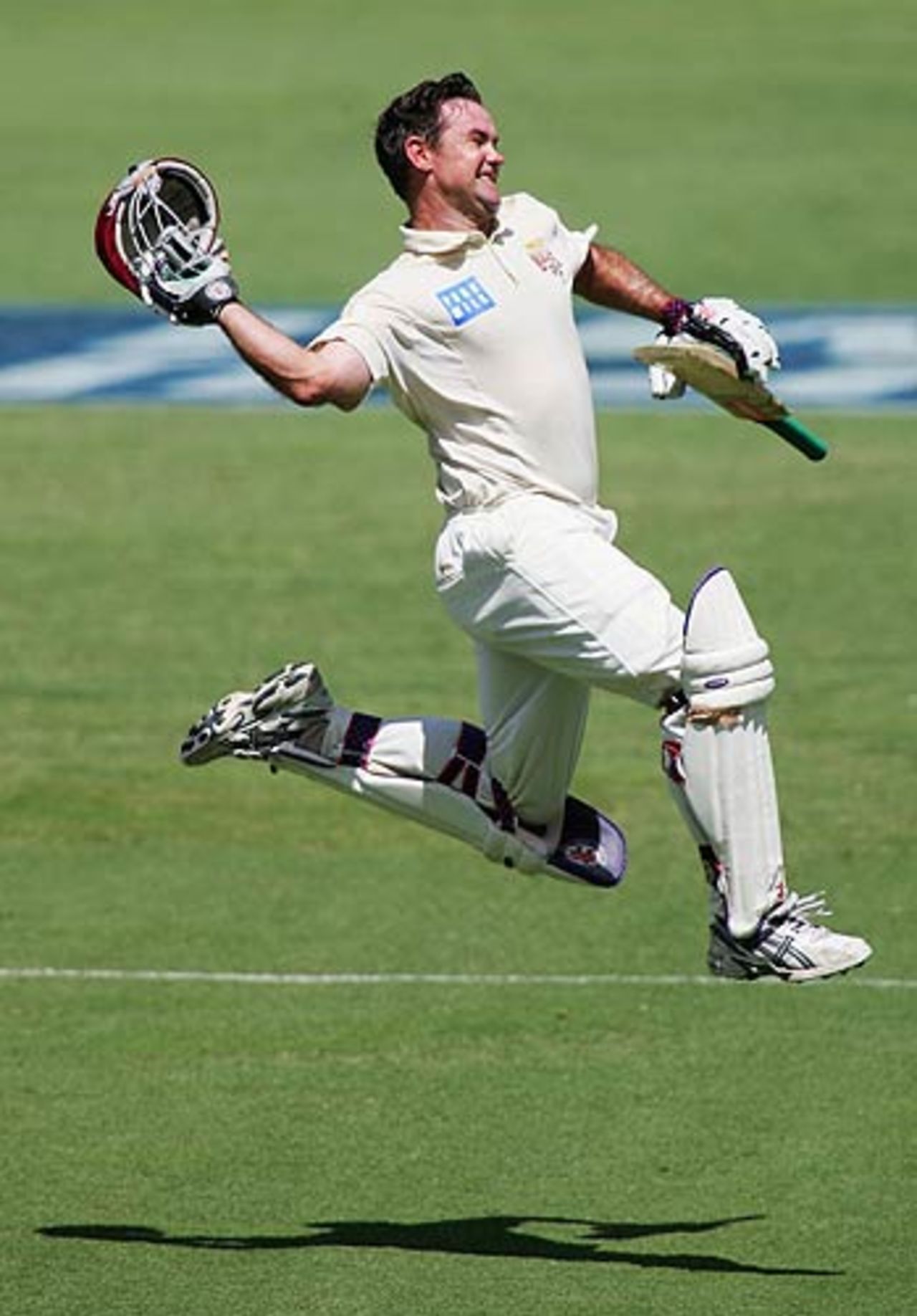 Jimmy Maher celebrates his double-century on the third day of the Pura Cup final at the Gabba, Queensland v Victoria, Pura Cup final, 3rd day, Brisbane, March 26, 2006