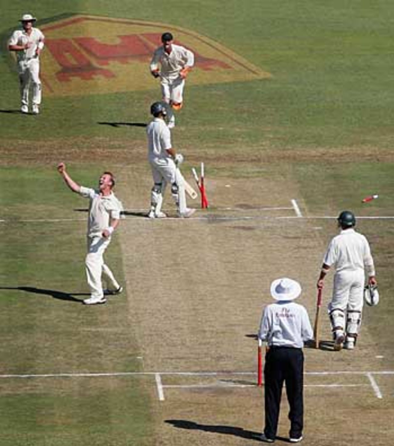 Brett Lee throws his arms up after taking his 200th Test wicket, South Africa v Australia, 2nd Test, Durban, March 26, 2006