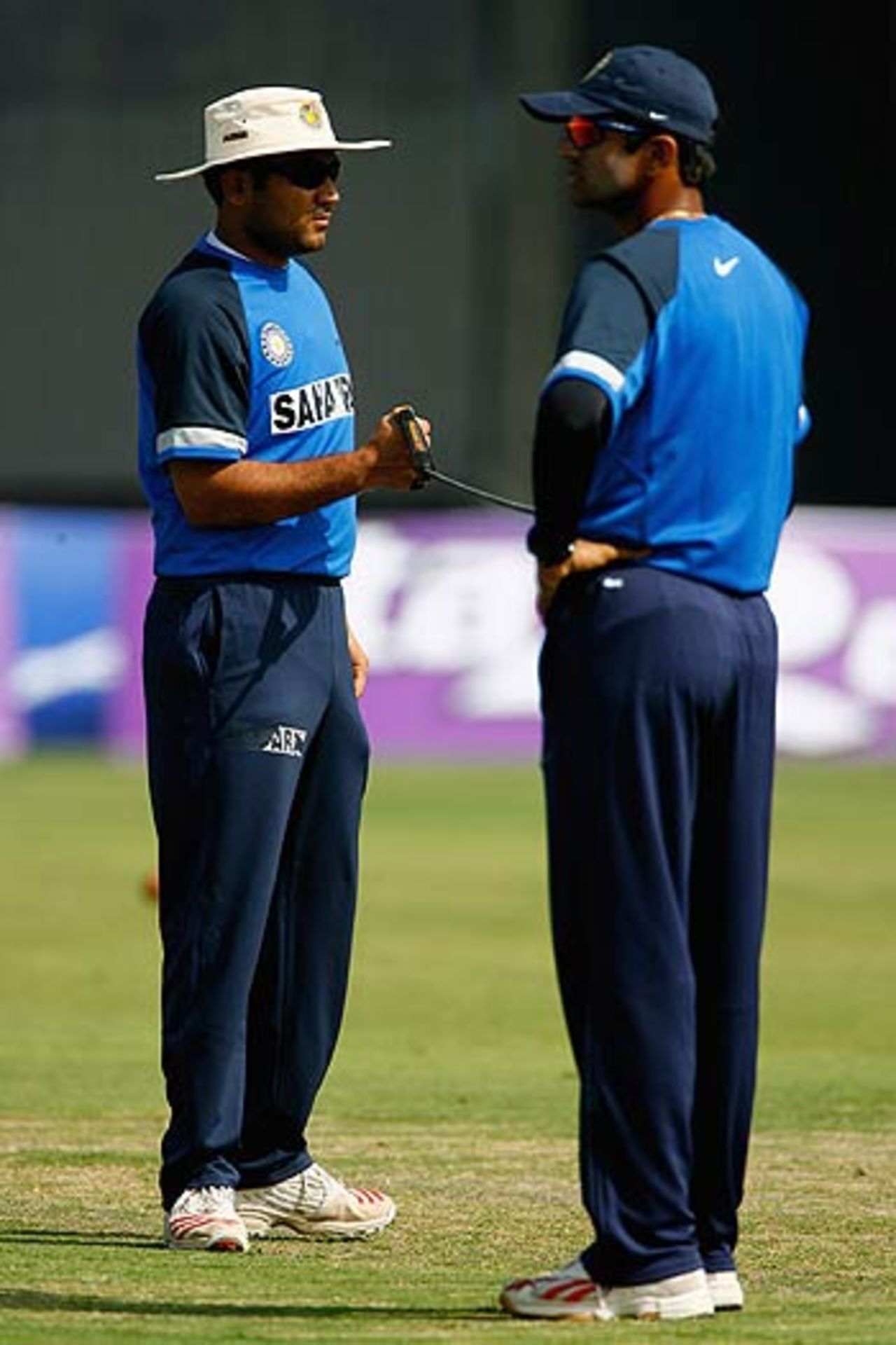 Rahul Dravid helps Virender Sehwag with his stretching, Delhi, March 27, 2006