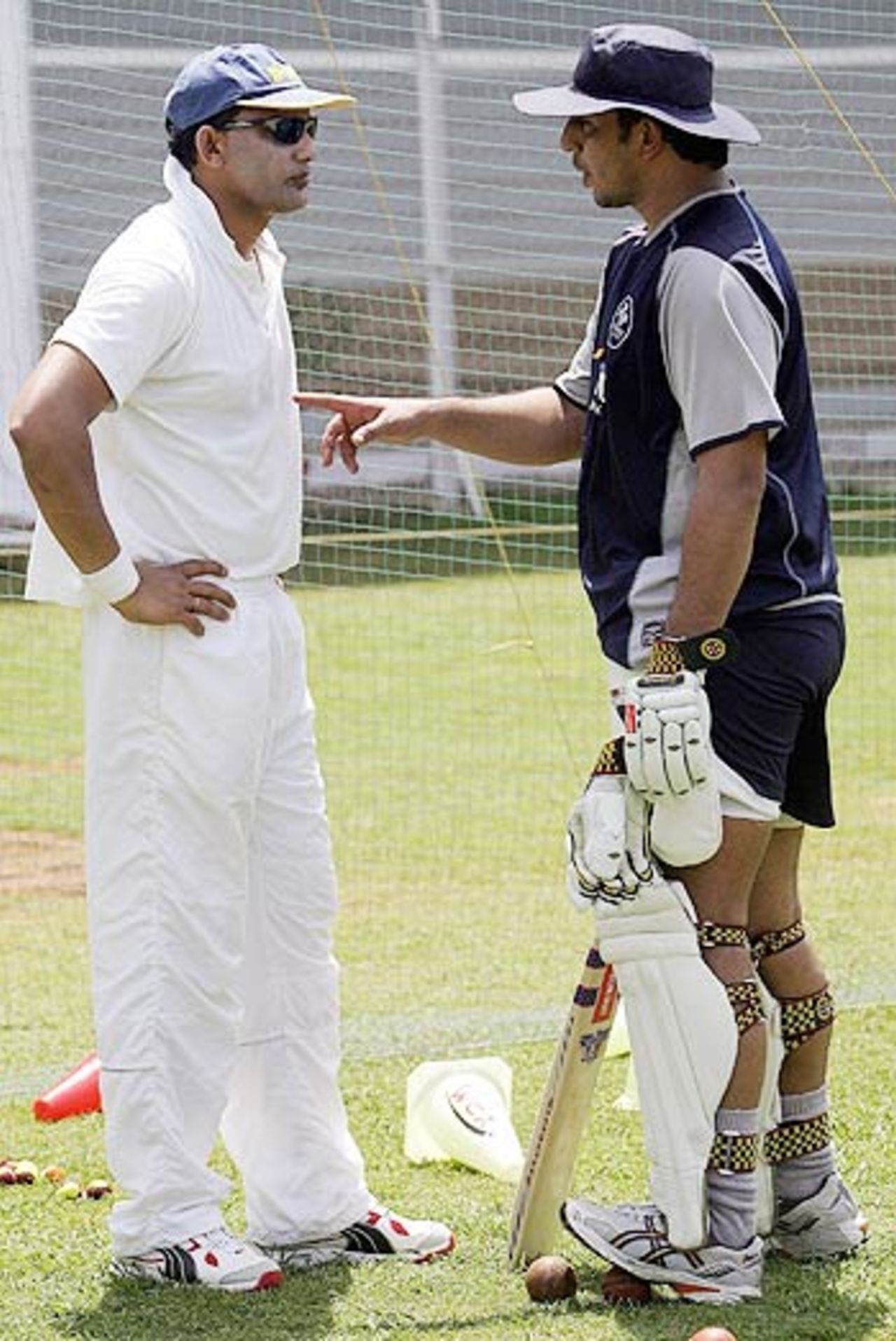 Mohammad Azharuddin and Azhar Mahmood chat during practice at the World Cricket Academy in Mumbai, Mumbai, March 27, 2006