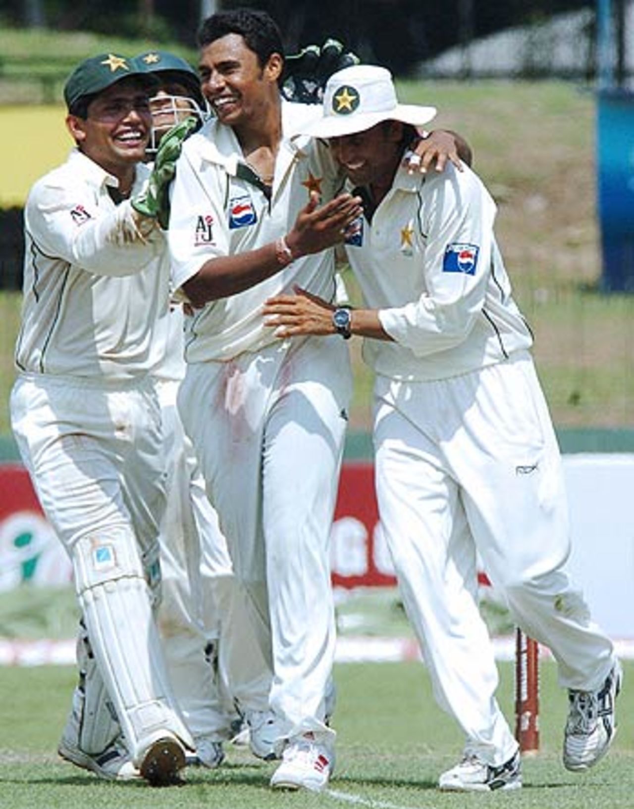 Pakistan cricketers celebrate the fall of the last Sri Lankan wicket, Sri Lanka v Pakistan, 1st Test, Colombo (SSC), 2nd day, March 27, 2006