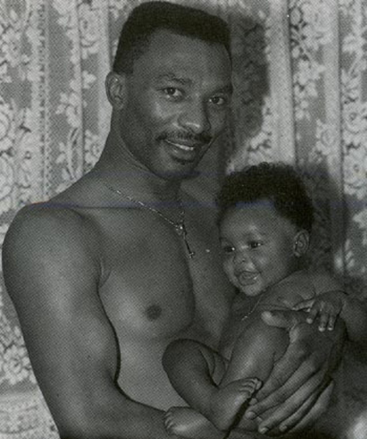 Neil Williams holds his son, Beresford