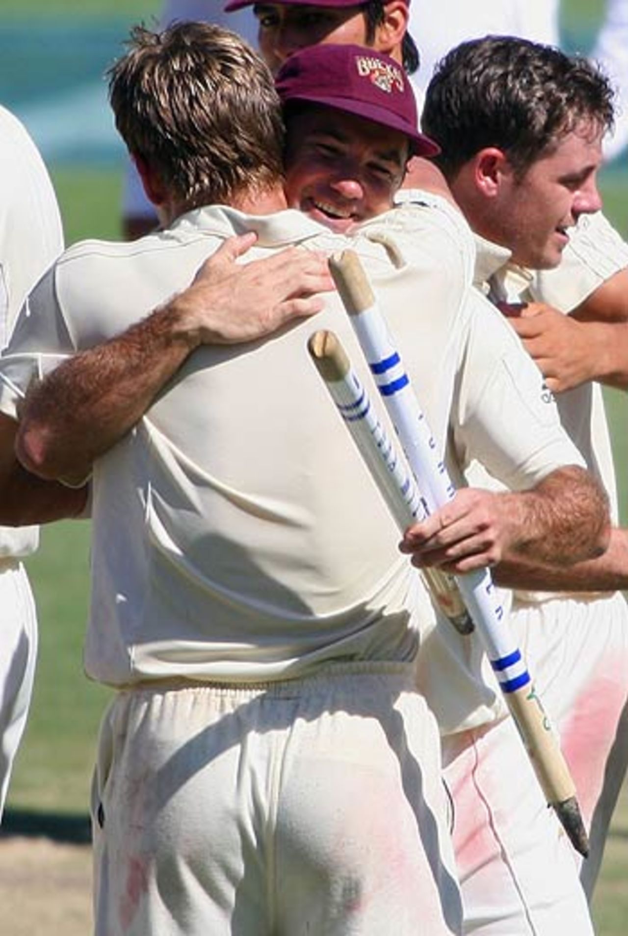 Jimmy Maher and Andy Bichel celebrate the victory, Queensland v Victoria, Pura Cup final, Brisbane, 5th day, March 28, 2006