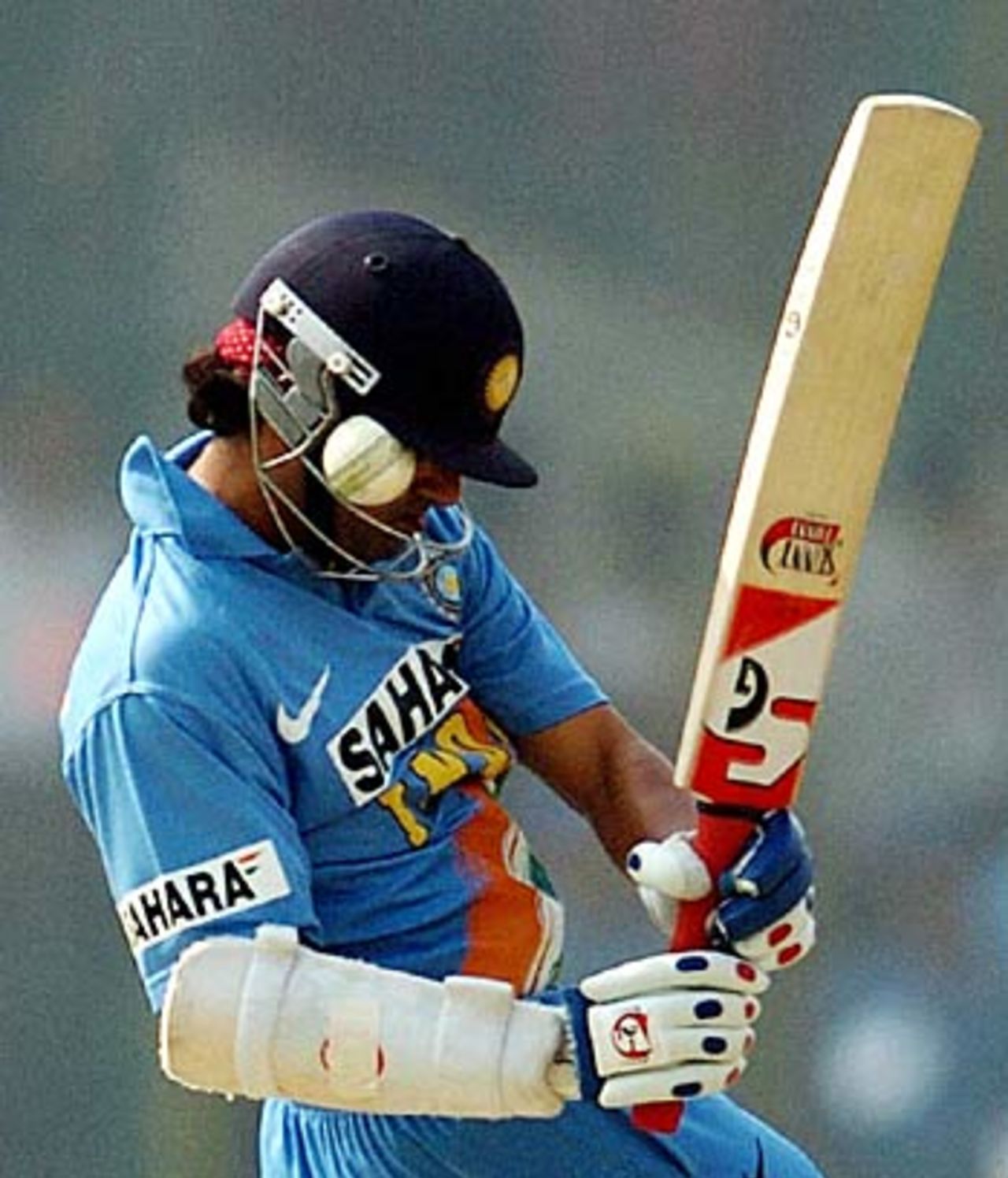 Gautham Gambhir escapes a painful blow as the ball gets lodged between the peak of the helmet and visor, India v England, 1st ODI, New Delhi, March 28 2006