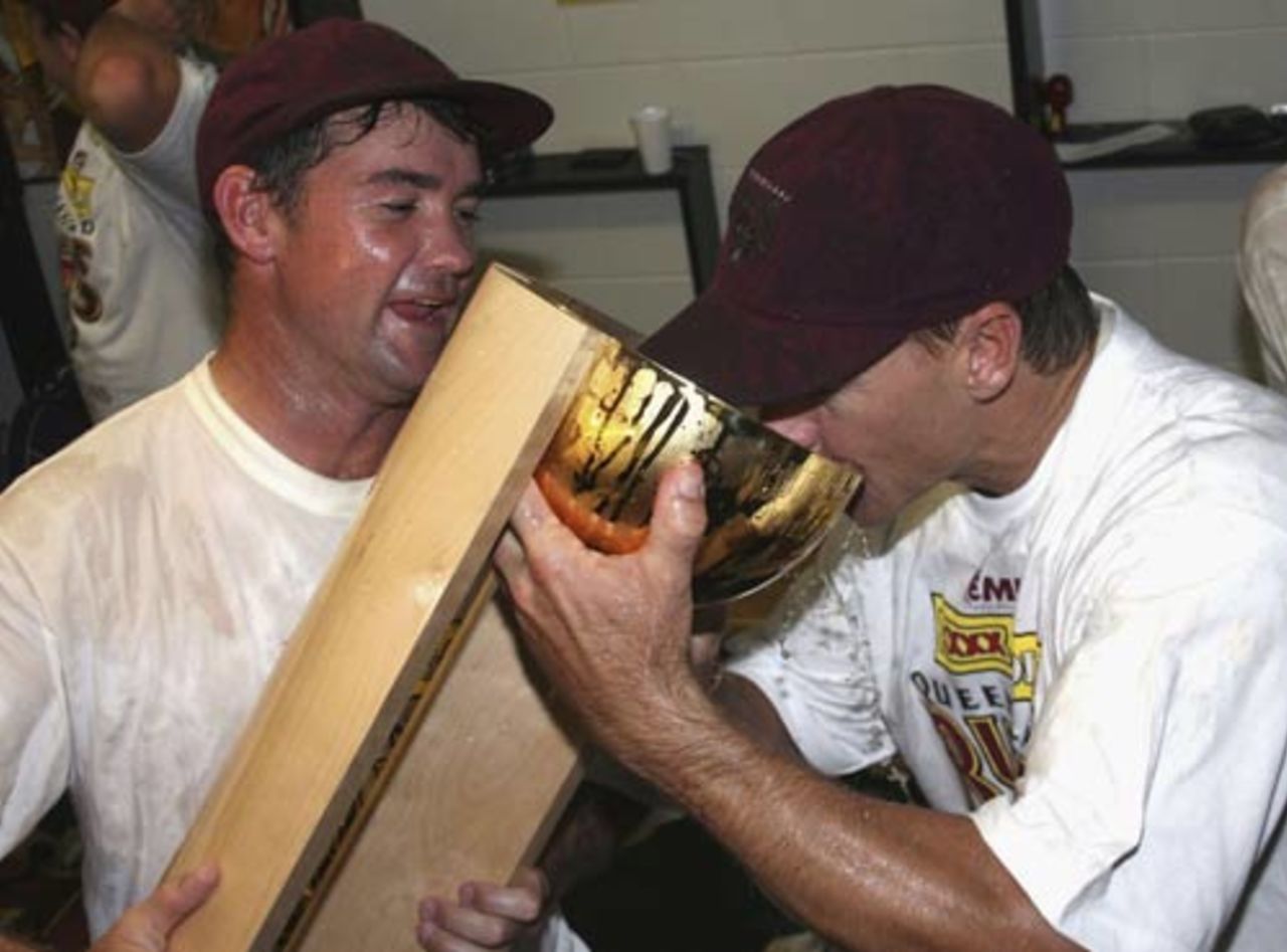 Jimmy Maher and Andy Bichel celebrate the victory in style, Queensland v Victoria, Pura Cup final, Brisbane, 5th day, March 28, 2006