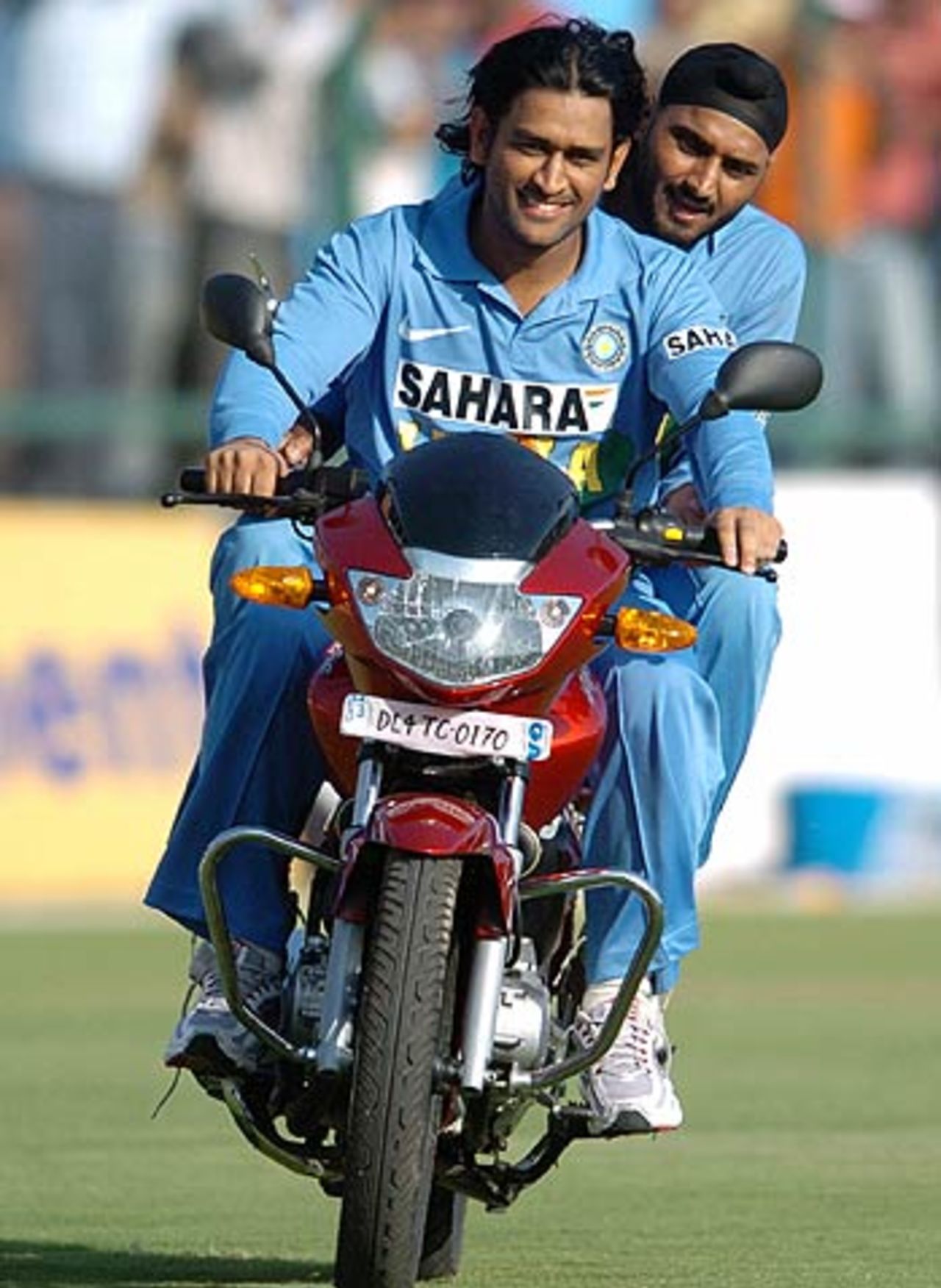 Mahendra Singh Dhoni and Harbhajan Singh take the bike for a spin in the outfield, India v England, 1st ODI, New Delhi, March 28 2006