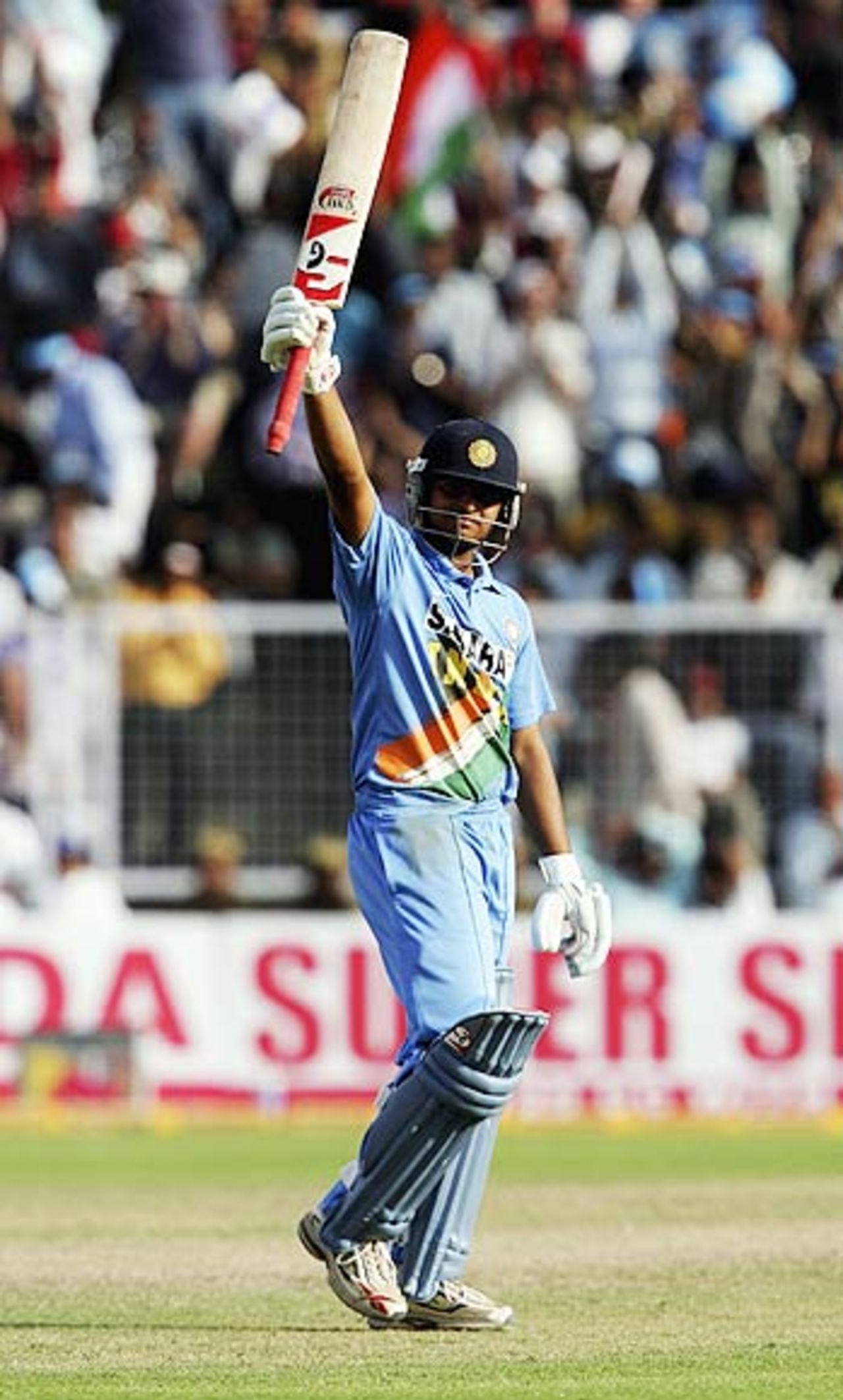 Suresh Raina raises his bat on completing a maiden fifty, India v England, 2nd ODI, Faridabad, March 31, 2006