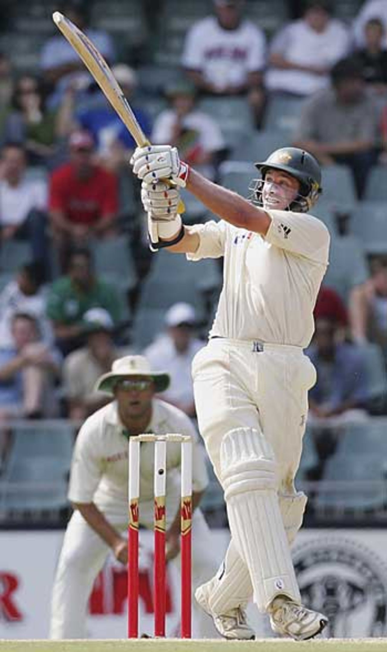 On the rise: Mike Hussey swings for four, South Africa v Australia, 3rd Test, Johannesburg, April 1, 2006