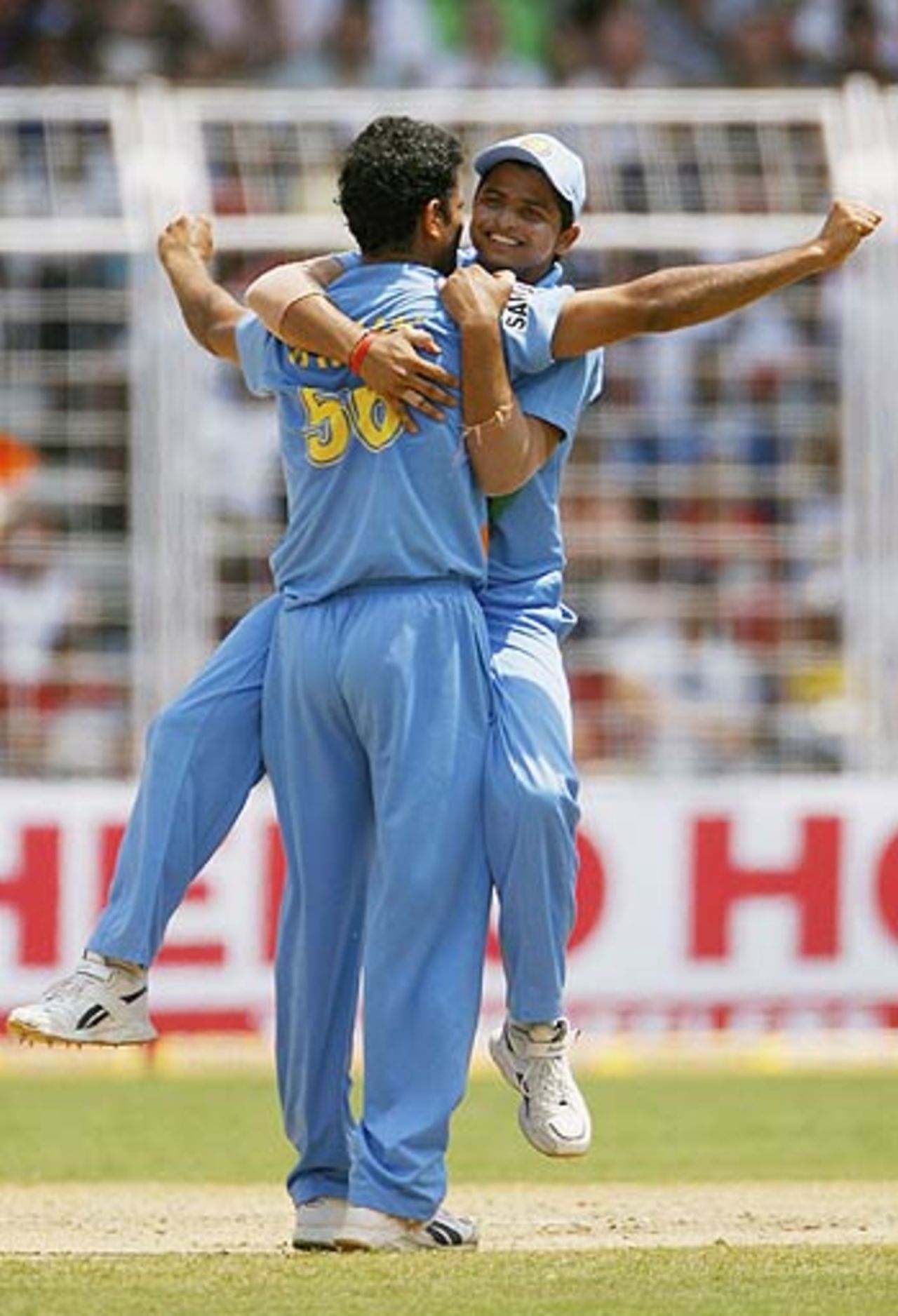 Irfan Pathan and Suresh Raina celebrate a wicket , India v England, 3rd ODI, Goa, April 3, 2006