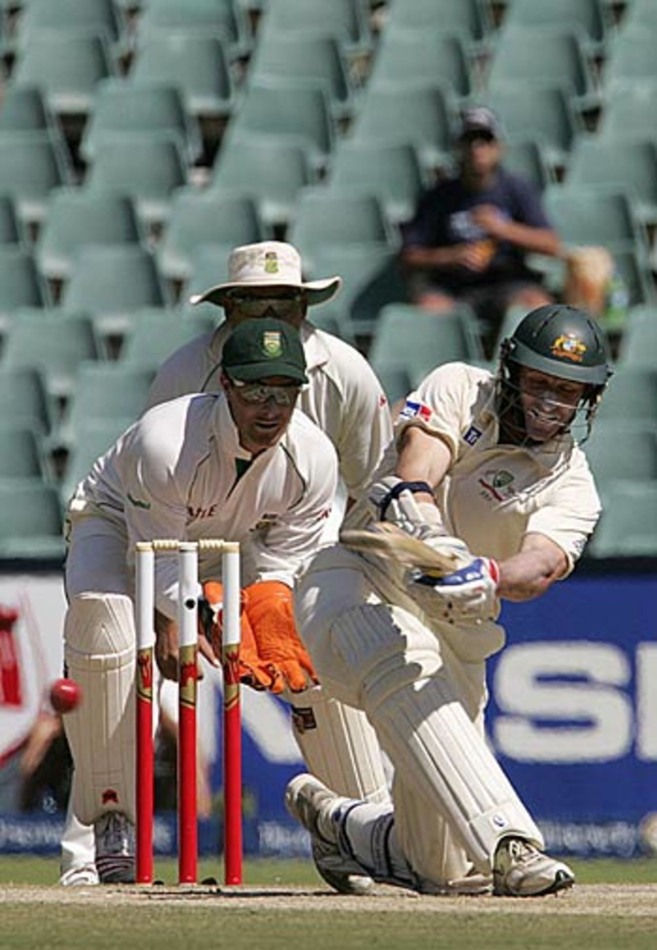 Mike Hussey connects with a sweep during his 89, South Africa v Australia, 3rd Test, Johannesburg, April 3, 2006