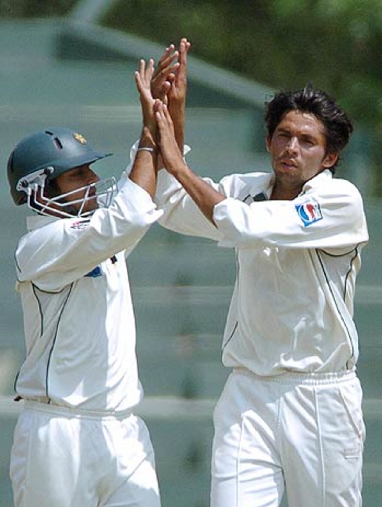 Faisal Iqbal and Mohammad Asif celebrate the wicket of Nuwan Kulasekera, Sri Lanka v Pakistan, 2nd Test, Kandy, 2nd day, April 4, 2006