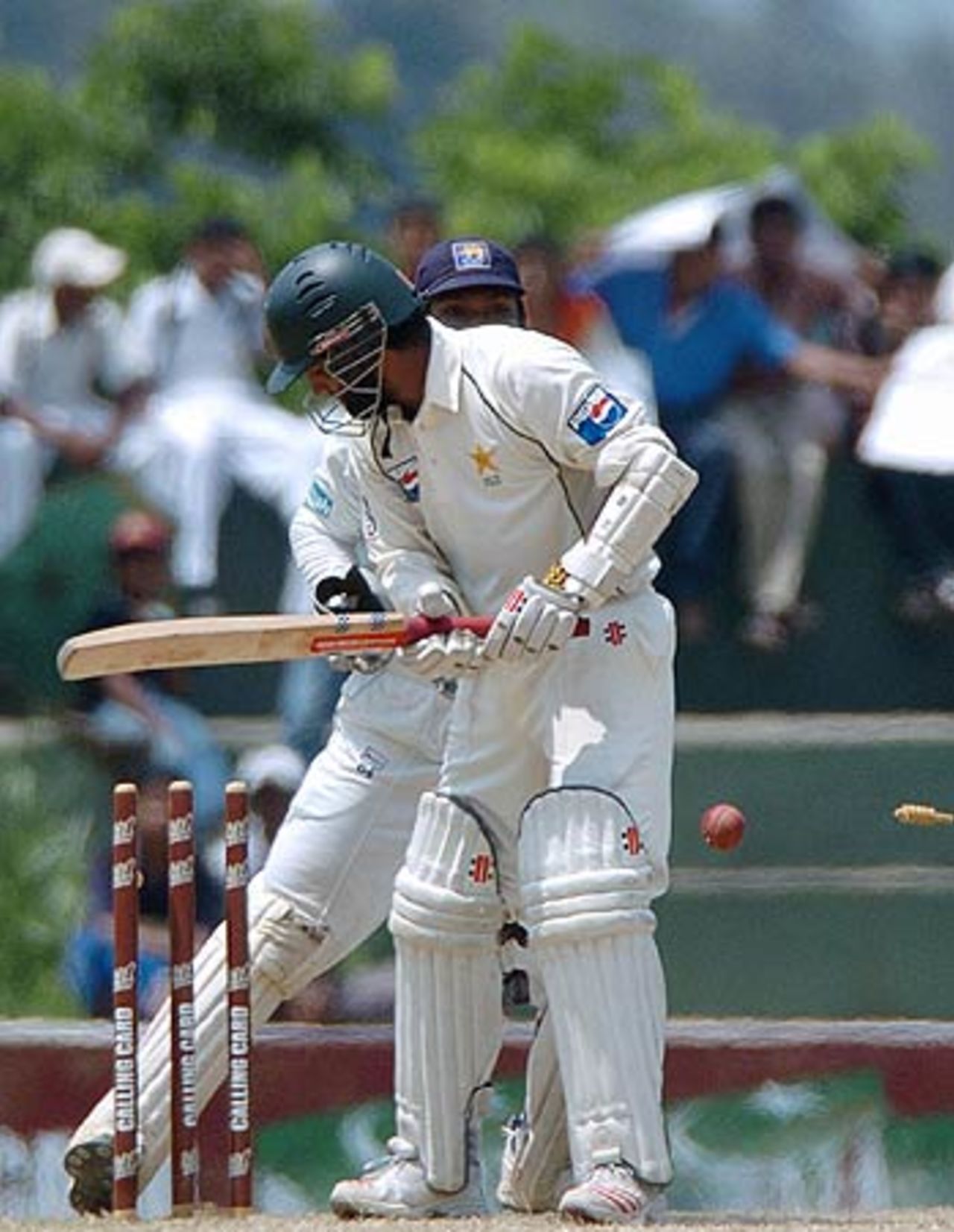 Mohammad Yousuf hears the death rattle as Muttiah Muralitharan strikes, Sri Lanka v Pakistan, 2nd Test, Kandy, 2nd day, April 4, 2006