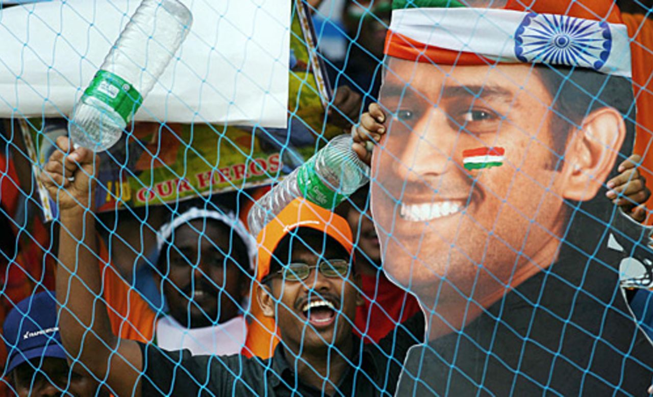 Super size me: an enlarged poster of Mahendra Singh Dhoni is held aloft, India v England, 4th ODI, Kochi, April 6 2006