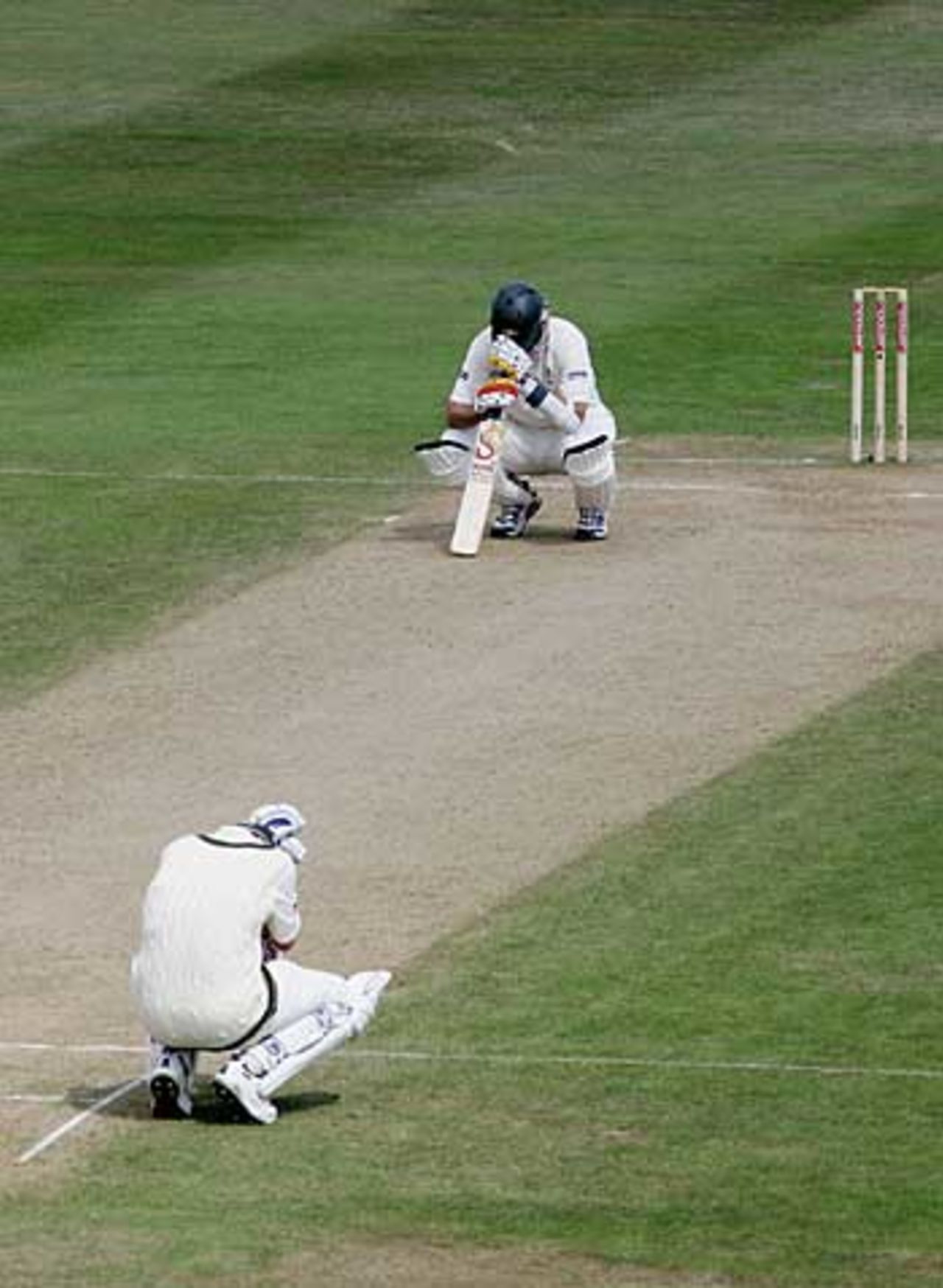 Brett Lee and Michael Kasprowicz immediately sink to their knees as England took the final wicket to win, on a nail-biting fourth day at Edgbaston, England v Australia, August 7, 2005