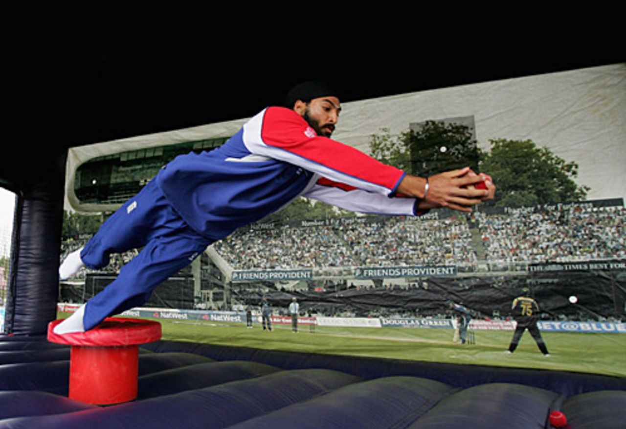 Super catch, that. Monty Panesar tries out the extreme catching machine at the NatWest CricketForce 2006 event, Upminster Cricket Club, Essex, April 7, 2006
