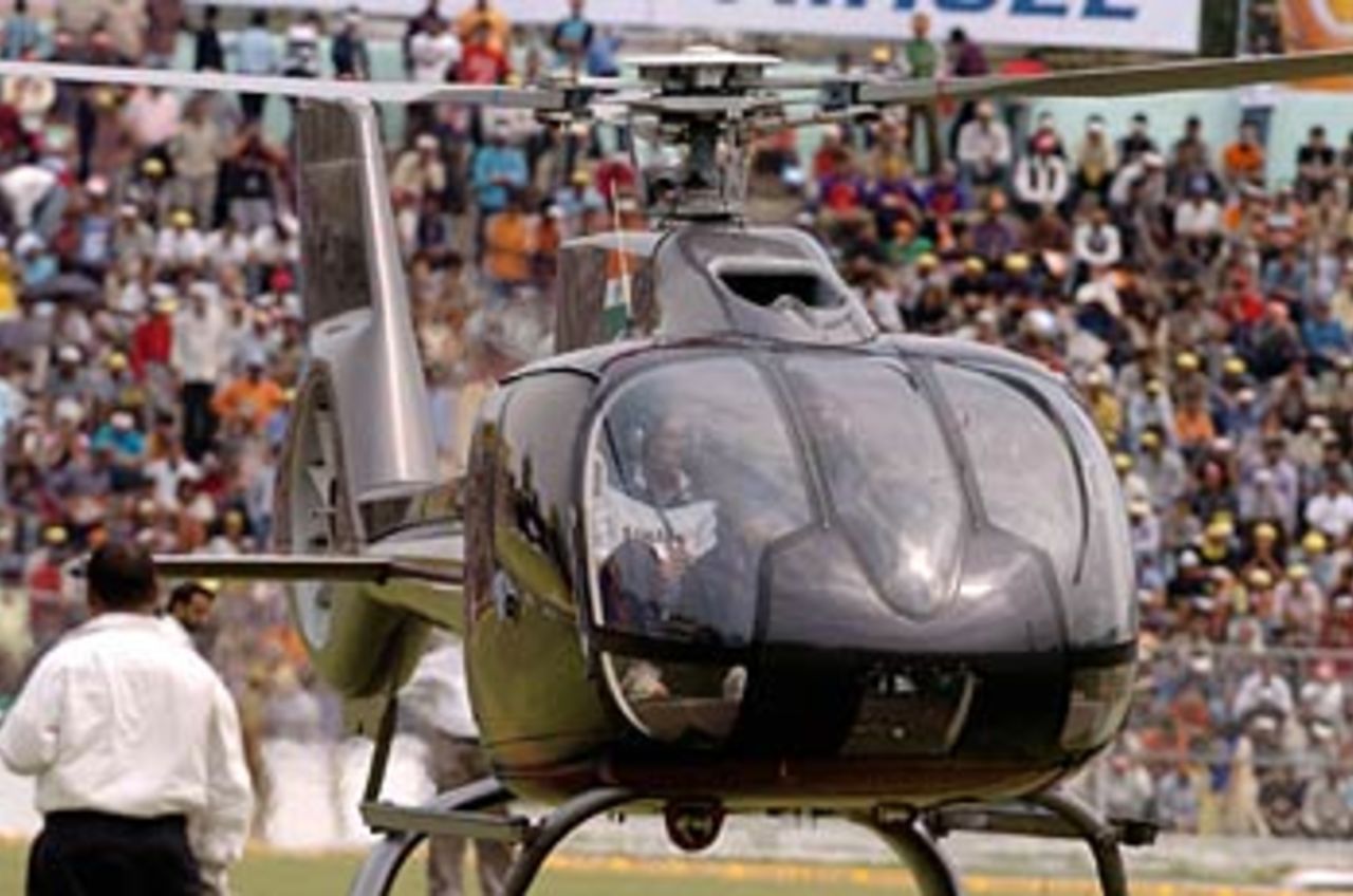 Bikes to helicopters: Mahendra Singh Dhoni hitches a ride in the helicopter, India v England, Guwahati,  April 8, 2006