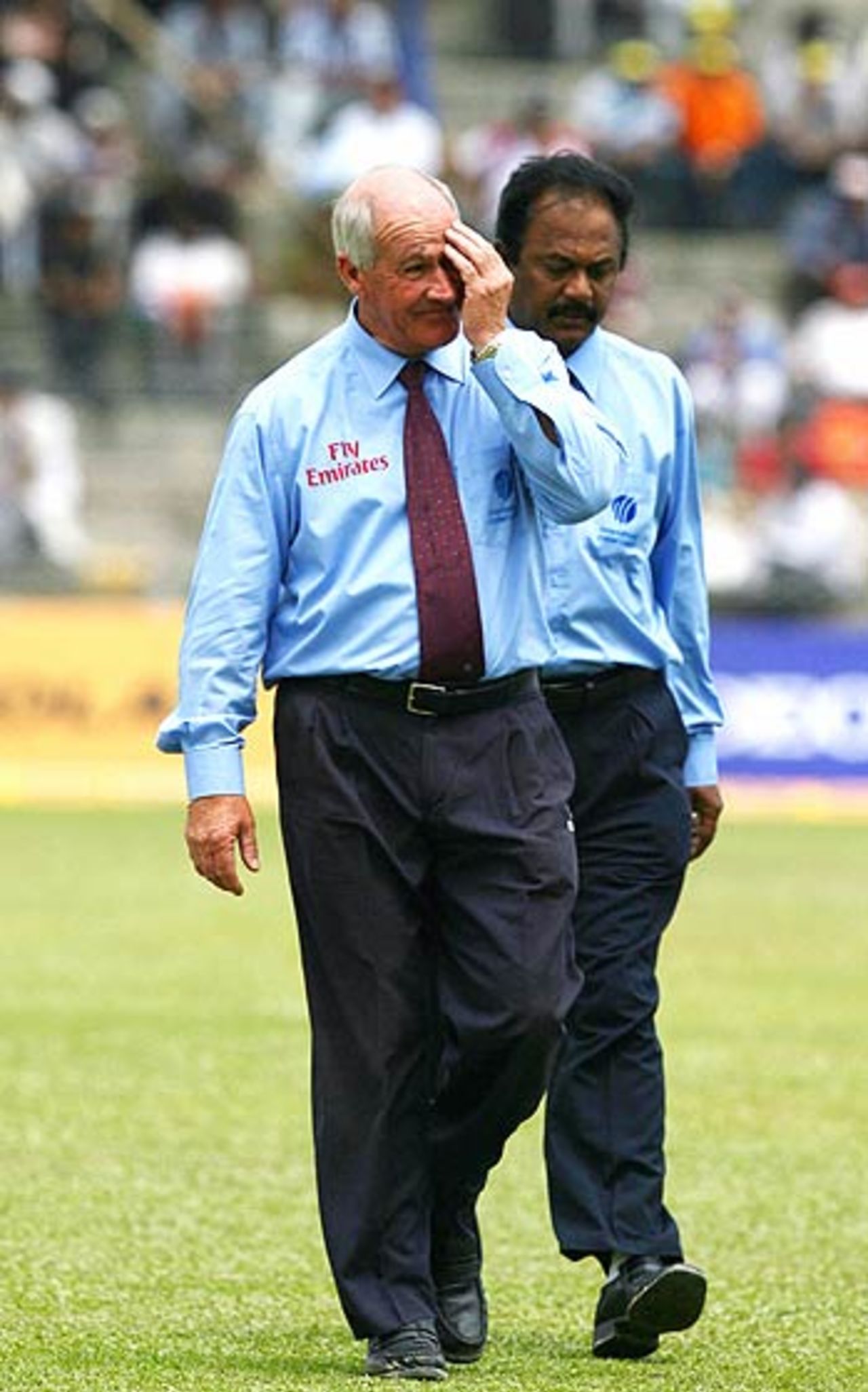 Rudi Koertzen and AV Jayaprakash walk off the ground at the Nehru Stadium, India v England, 5th ODI, Guwahati,  April 8, 2006