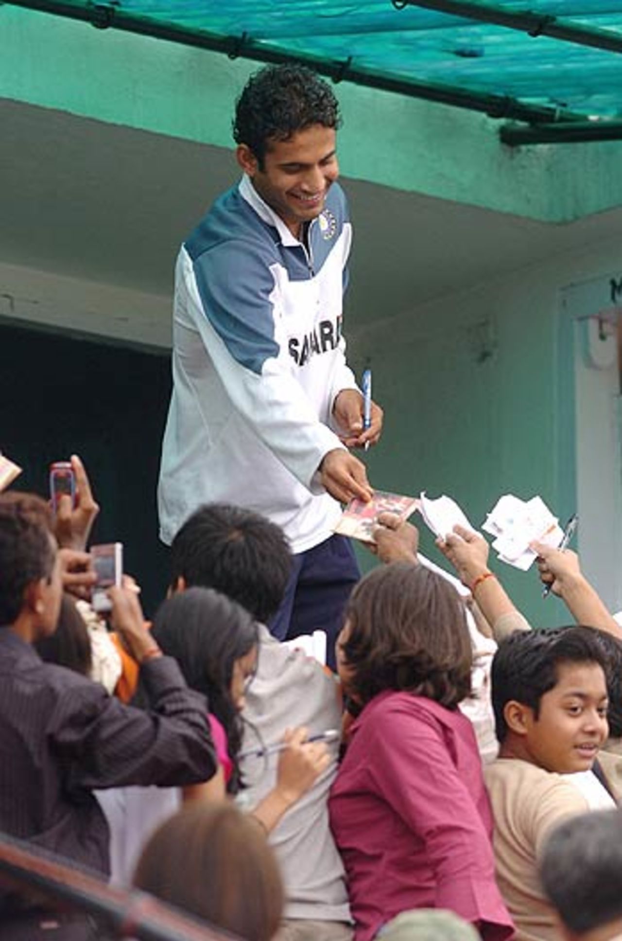 Irfan Pathan acknowledges fans with some autographs, India v England, 5th ODI, Guwahati,  April 8, 2006