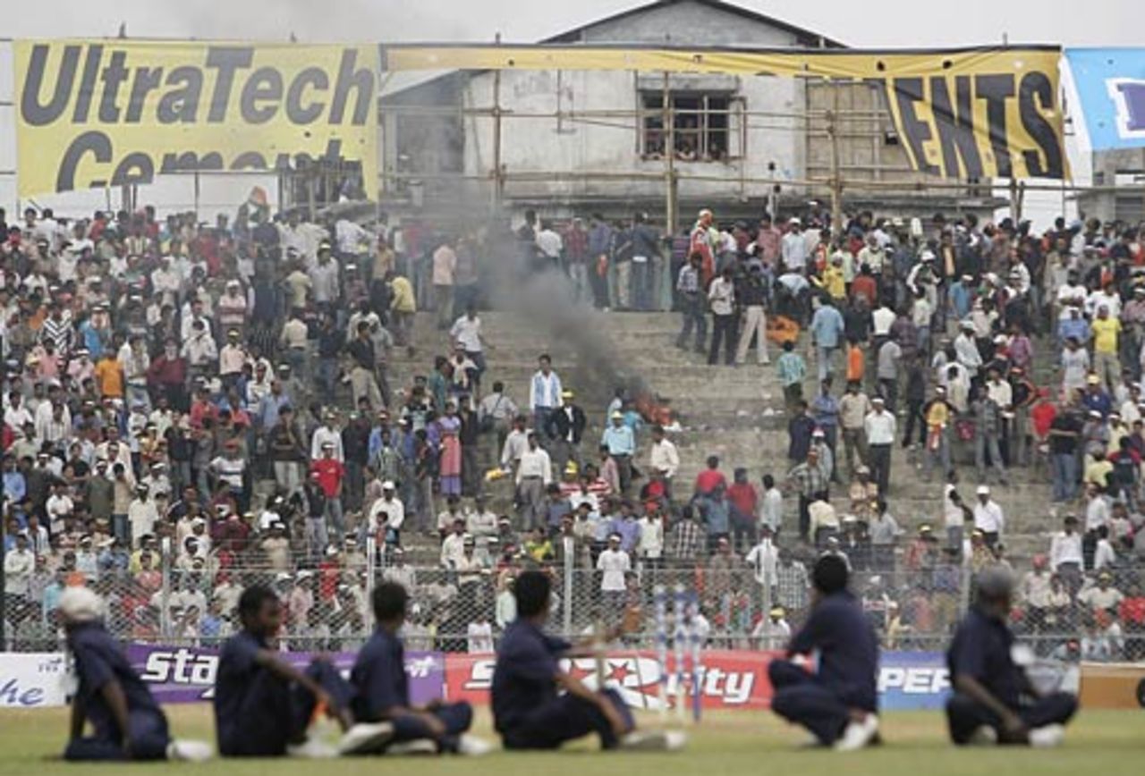 Just before the game was called off,  fans in the stands lit fires and threw stones, India v England, 5th ODI, Guwahati,  April 8, 2006
