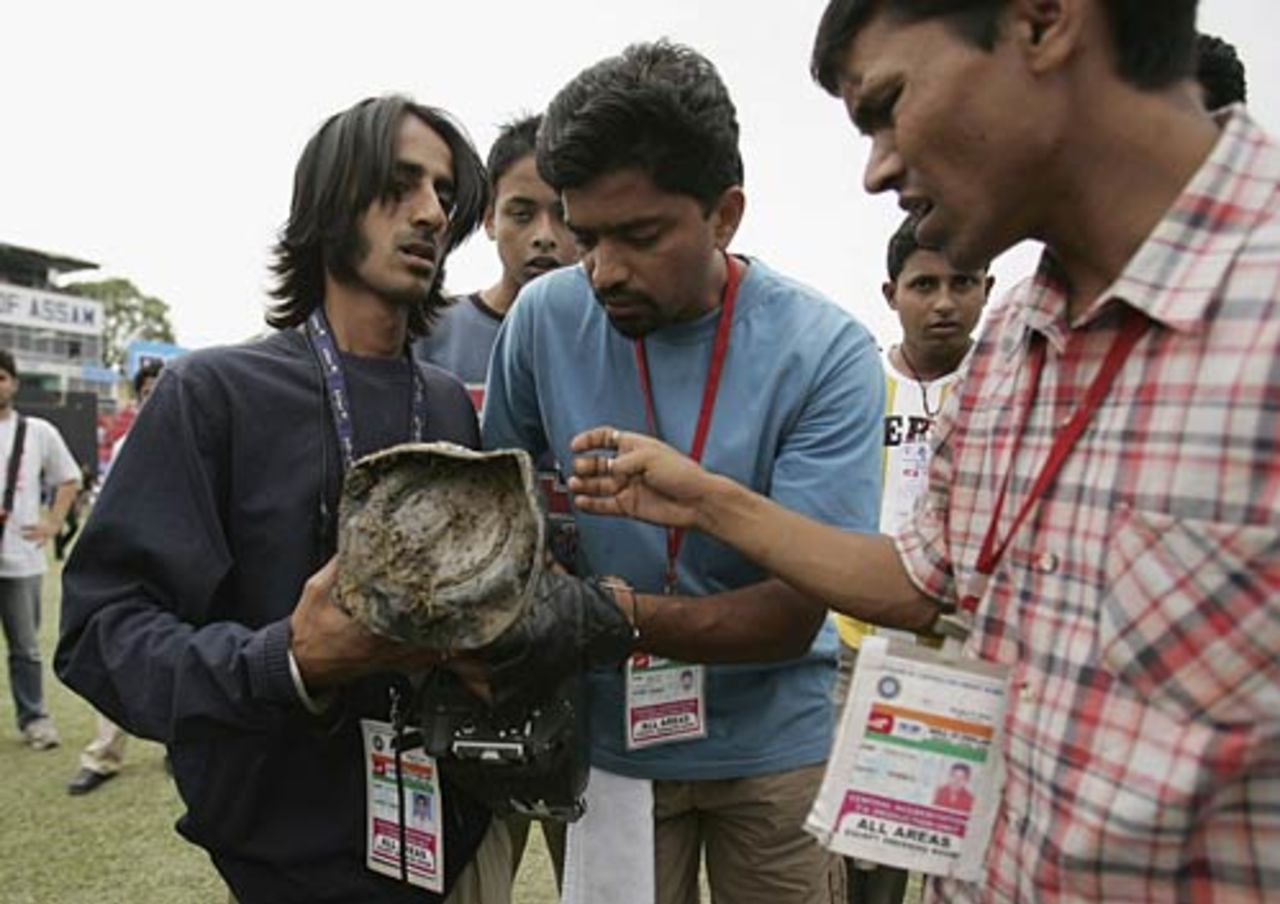 TV crew examine the damage to the camera as violence broke out, India v England, 5th ODI, Guwahati,  April 9, 2006