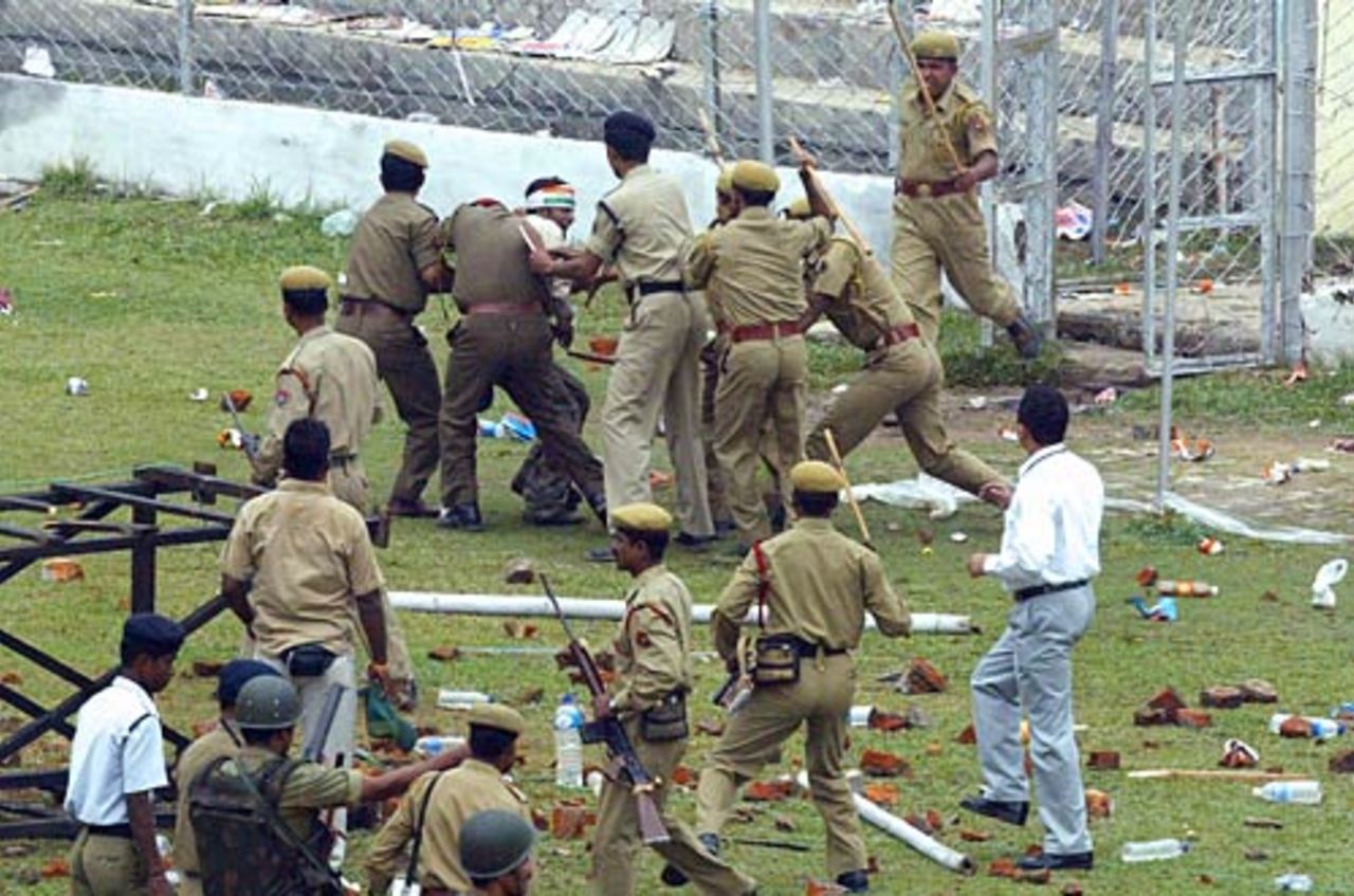 Policemen arrest a unruly element in the crowd, India v England, 5th ODI, Guwahati,  April 9, 2006