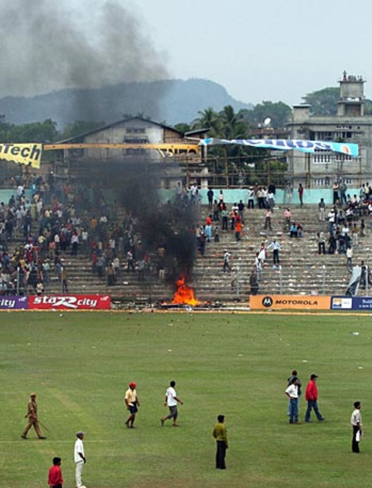 Fires burn in the stands after the game was abandoned, India v England, 5th ODI, Guwahati,  April 9, 2006