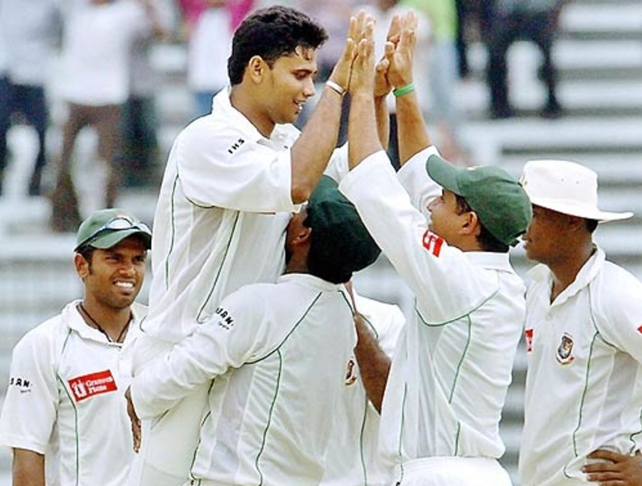 Mashrafe Mortaza is hoisted by his team-mates after striking the first blow,
Bangladesh v Australia, 1st Test, Fatullah, 3rd day, April 11 2006