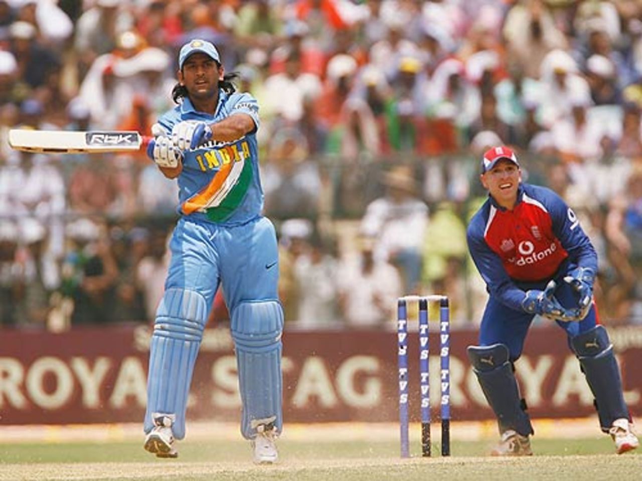 Mahendra Singh Dhoni smashes one to the midwicket fence, India v England, 6th ODI, Jamshedpur, April 12, 2006