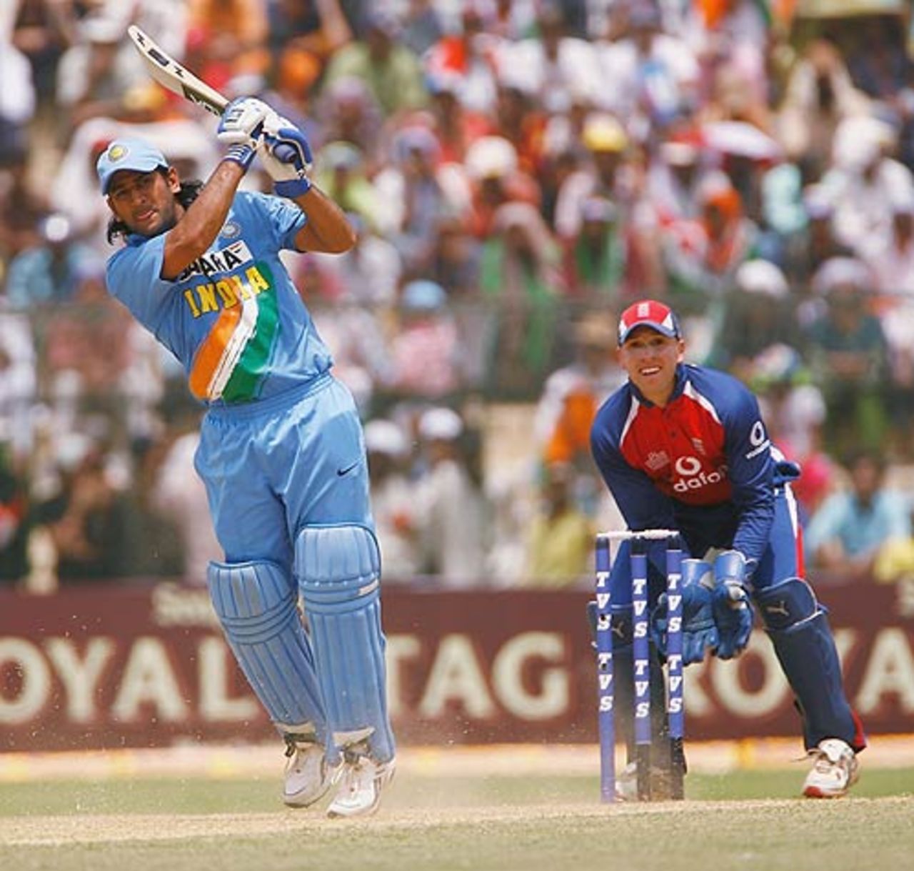 Mahendra Singh Dhoni drills down the ground, India v England, 6th ODI, Jamshedpur, April 12, 2006