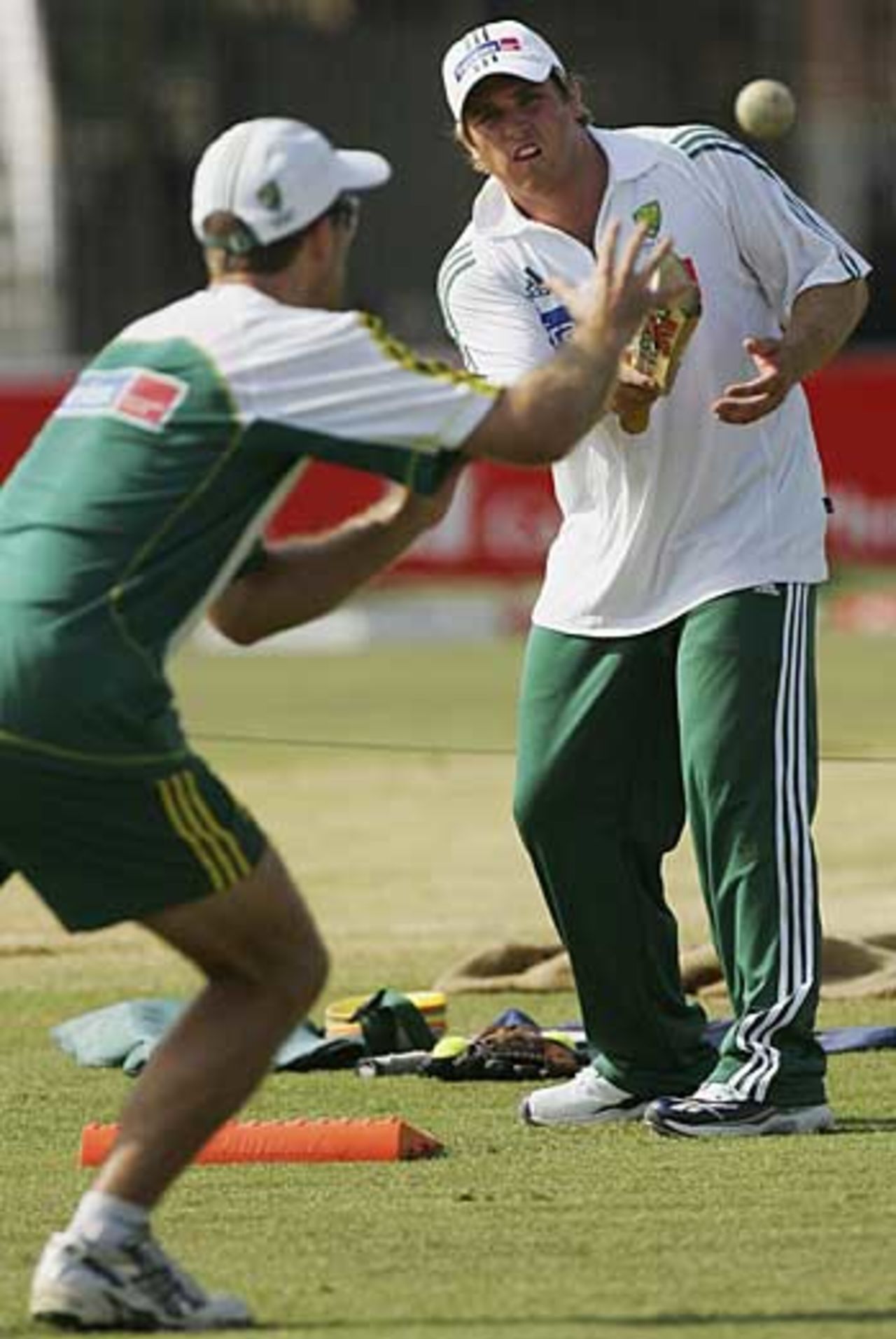 Mark Cosgrove gives Simon Katich catching practice, Chittagong, April 22, 2006