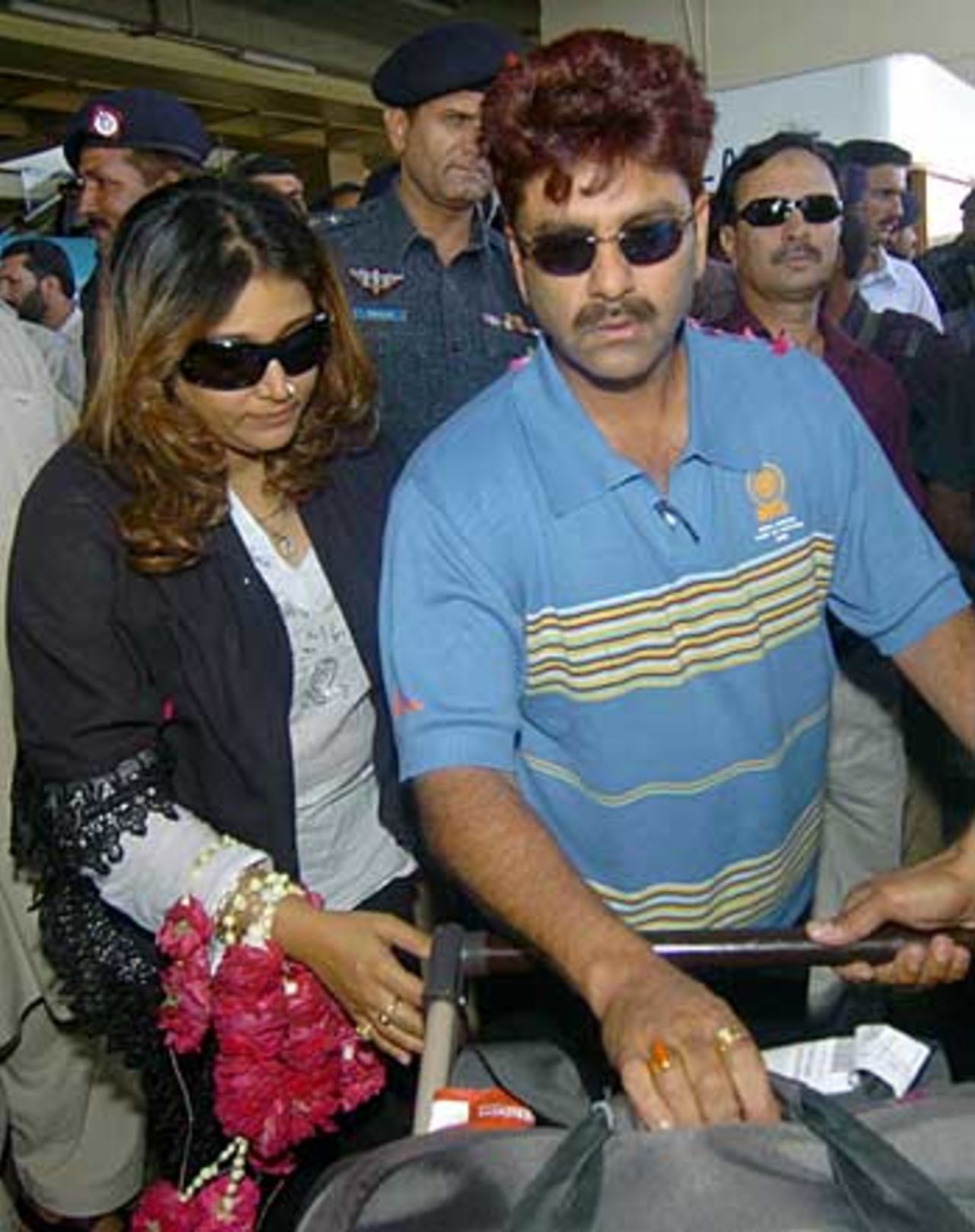 Manoj Prabhakar and his wife arrive in Karachi ahead of the India-Pakistan seniors match later this month, Karachi, April 22, 2006