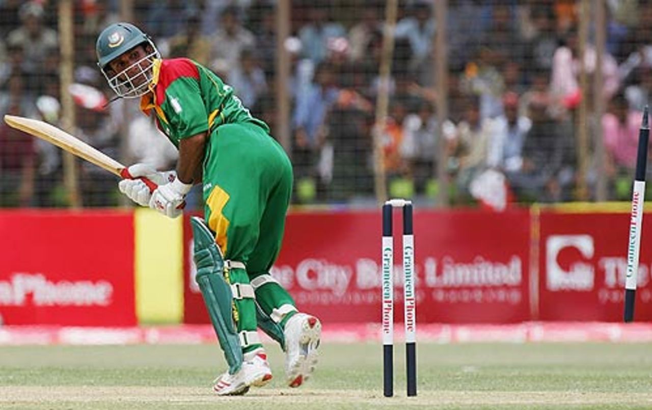 Khaled Mashud watches as his leg stump was uprooted out of the ground, Bangladesh v Australia, 1st ODI, Chittagong, April 23, 2006