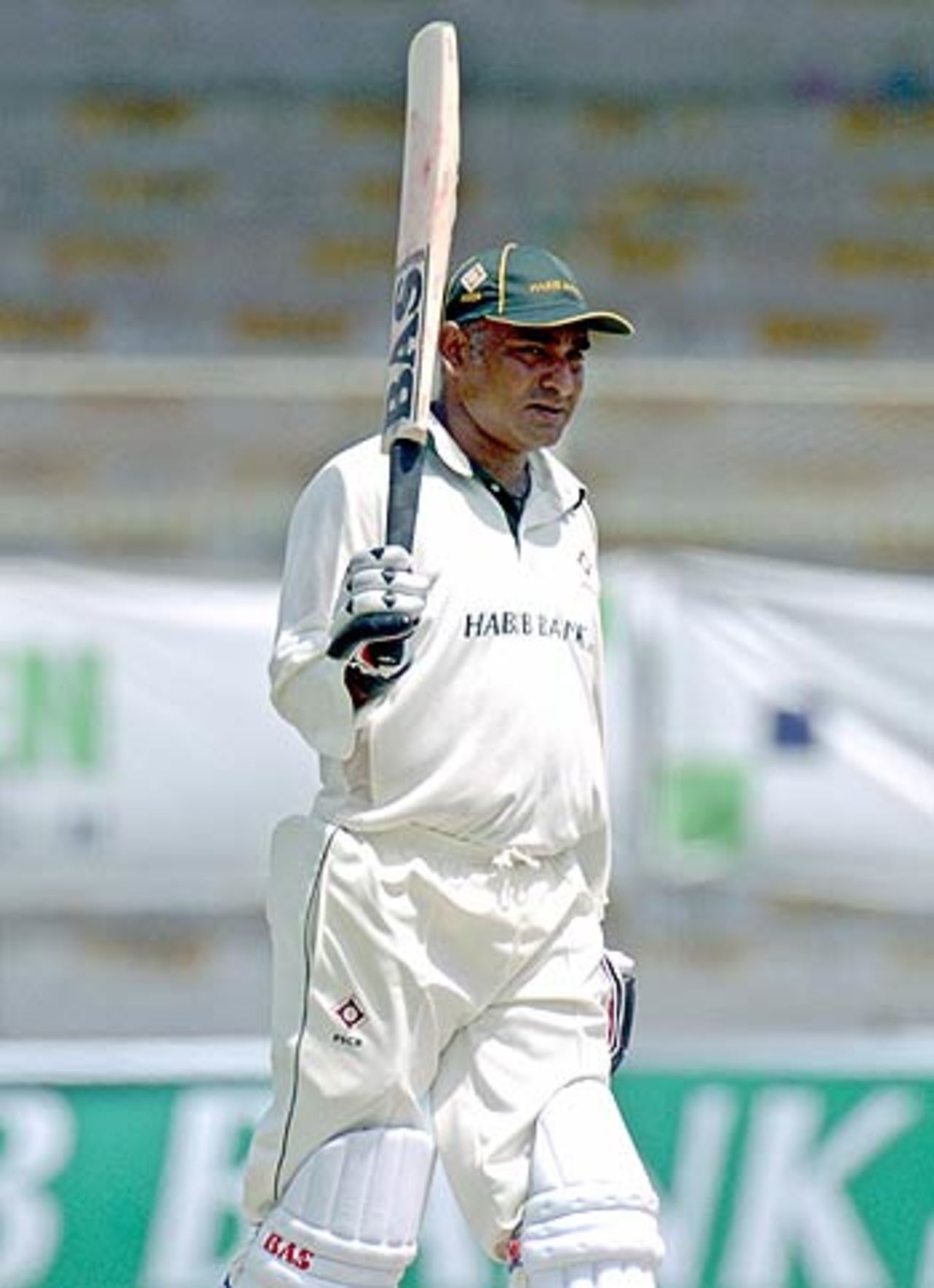 Aamer Sohail raises his bat after reaching his half-century, Pakistan Seniors v India Seniors, 1st one-dayer, Karachi, April 23, 2006
