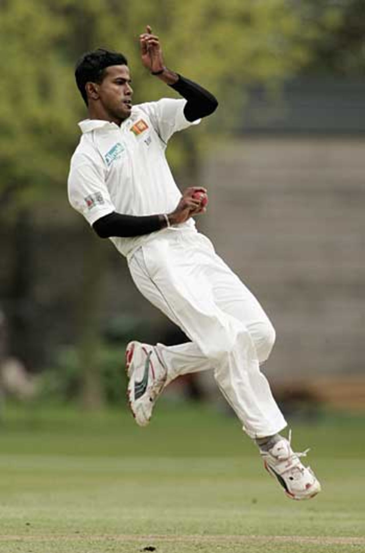 Nuwan Kulasekera roars up to the crease, British Universities v Sri Lankans, Tour match, Fenner's, April 26, 2006