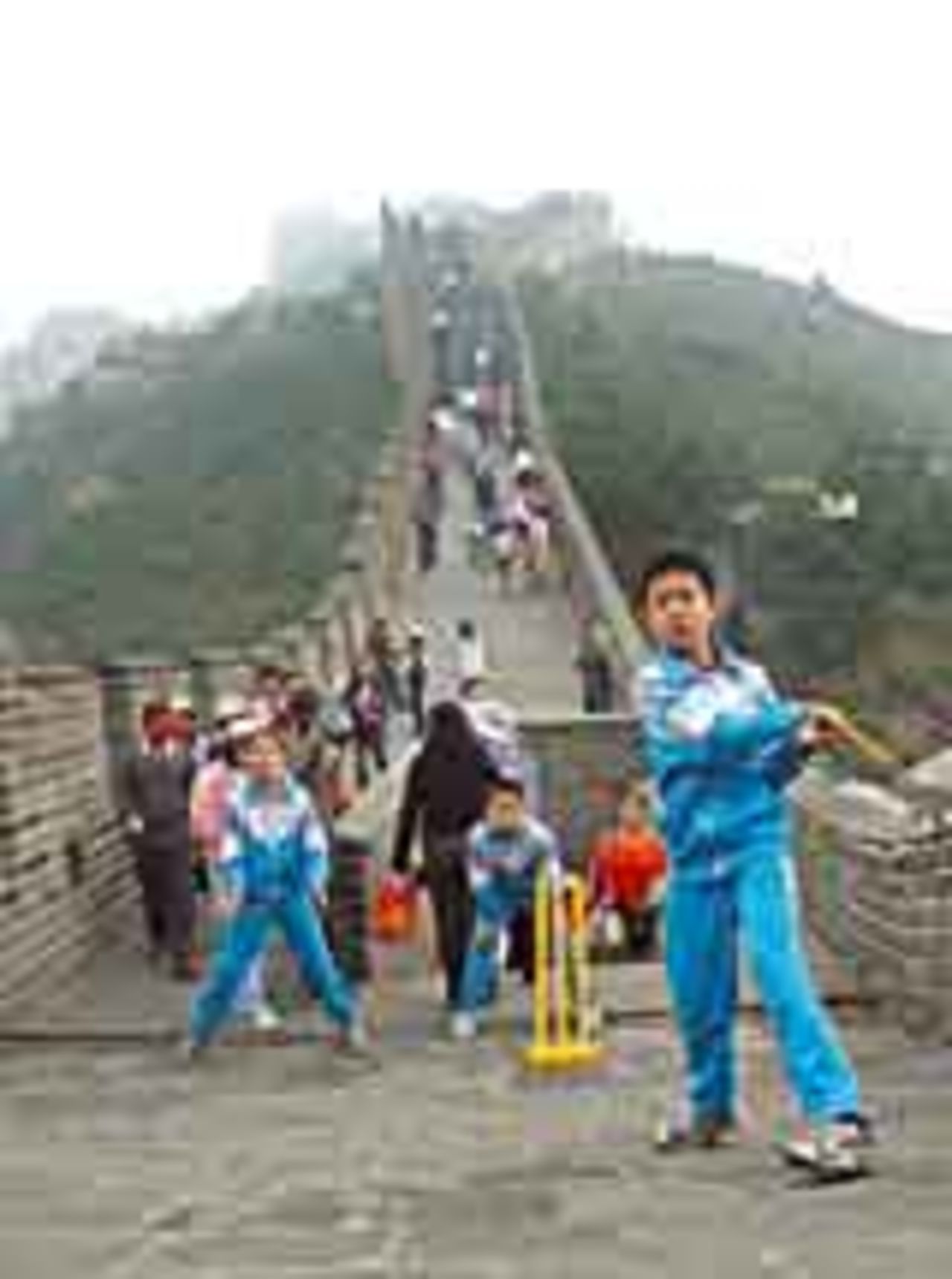 Chinese kids play cricket on a busy stretch of the Great Wall of China