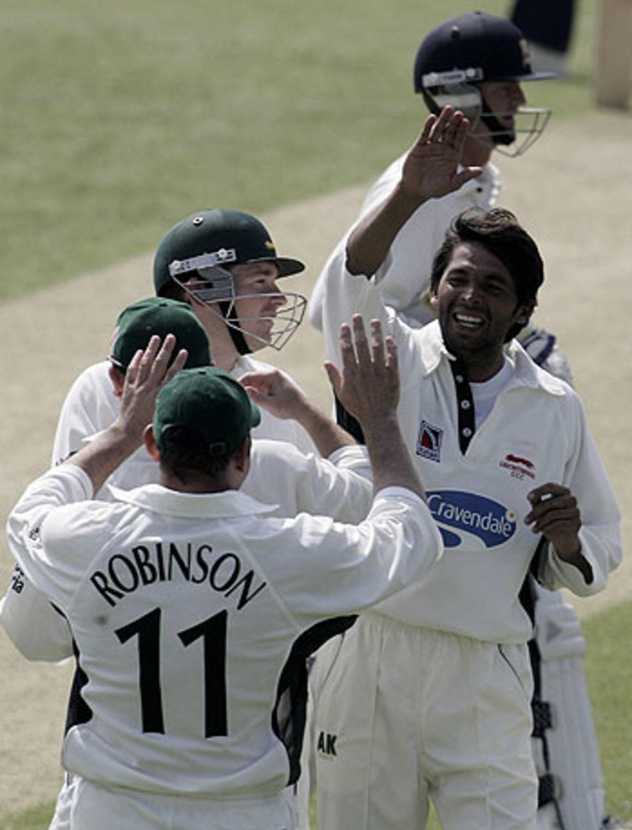 Mohammad Asif celebrates with his Leicestershire team-mates, Essex v Leicestershire, Chelmsford, May 4, 2006