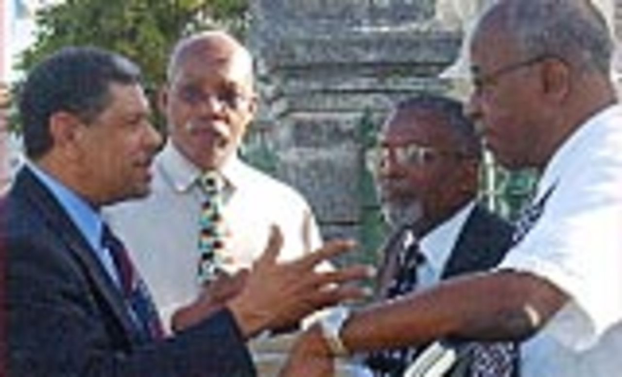 Attorney Peter Symmonds (left) making a point to BCA president Tony Marshall (right), general secretary Vernon Williams and business manager Rollins Howard (second from left) outside the High Court. Following an afternoon hearing in the No.5 Supreme Court, Justice William Chandler granted an injunction sought by attorney Ralph Thorne, on behalf of Bristol Cricket Club and its president, John Greaves. The Old Coleridge, St Peter-based Oran/Carib Bristol team, who won the Premier League in 2004 and were second last year, are contending they should be promoted to the Division 1 competition, Barbados, May 5, 2006