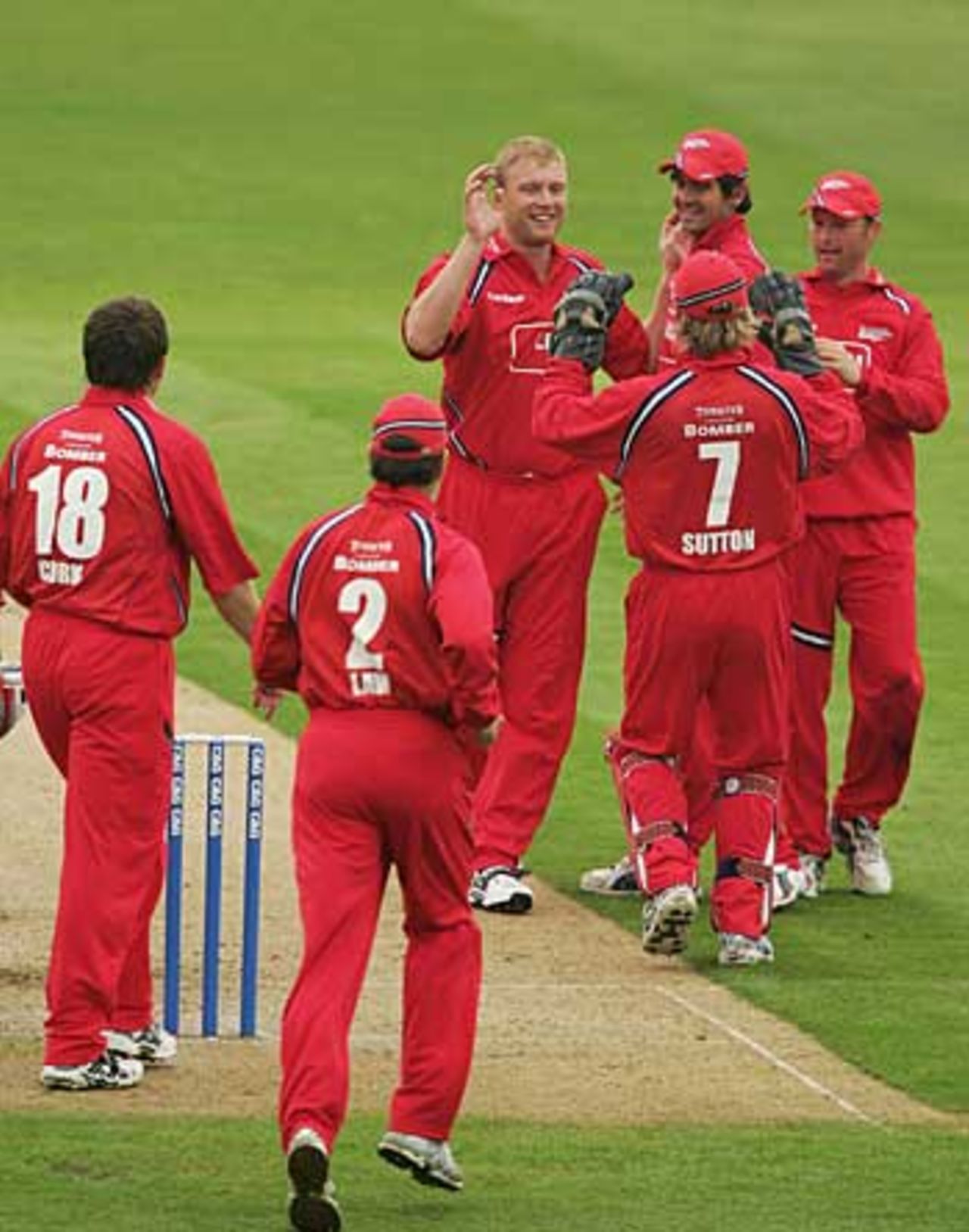 Andrew Flintoff is congratulated by his Lancashire team-mates on dismissing Usman Afzaal, Northamptonshire v Lancashire, C&G Trophy, Northampton, May 7, 2006