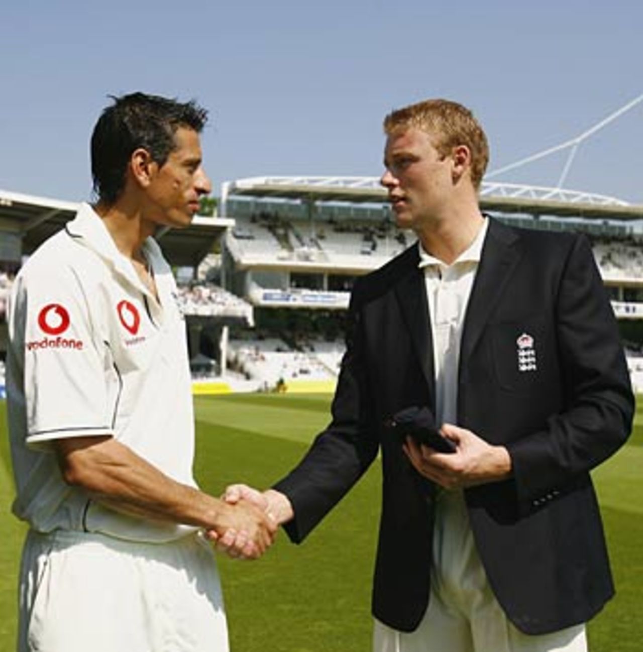 Sajid Mahmood is handed his cap by Andrew Flintoff before the start of play, England v Sri Lanka, 1st Test, Lord's, May 11, 2006
