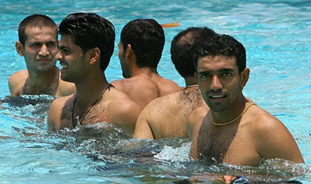 Robin Uthappa, Virender Sehwag, Mohammad Kaif, Rudra Pratap Singh and Irfan Pathan relax at the swimming pool after a jog, Kingston, May 13, 2006