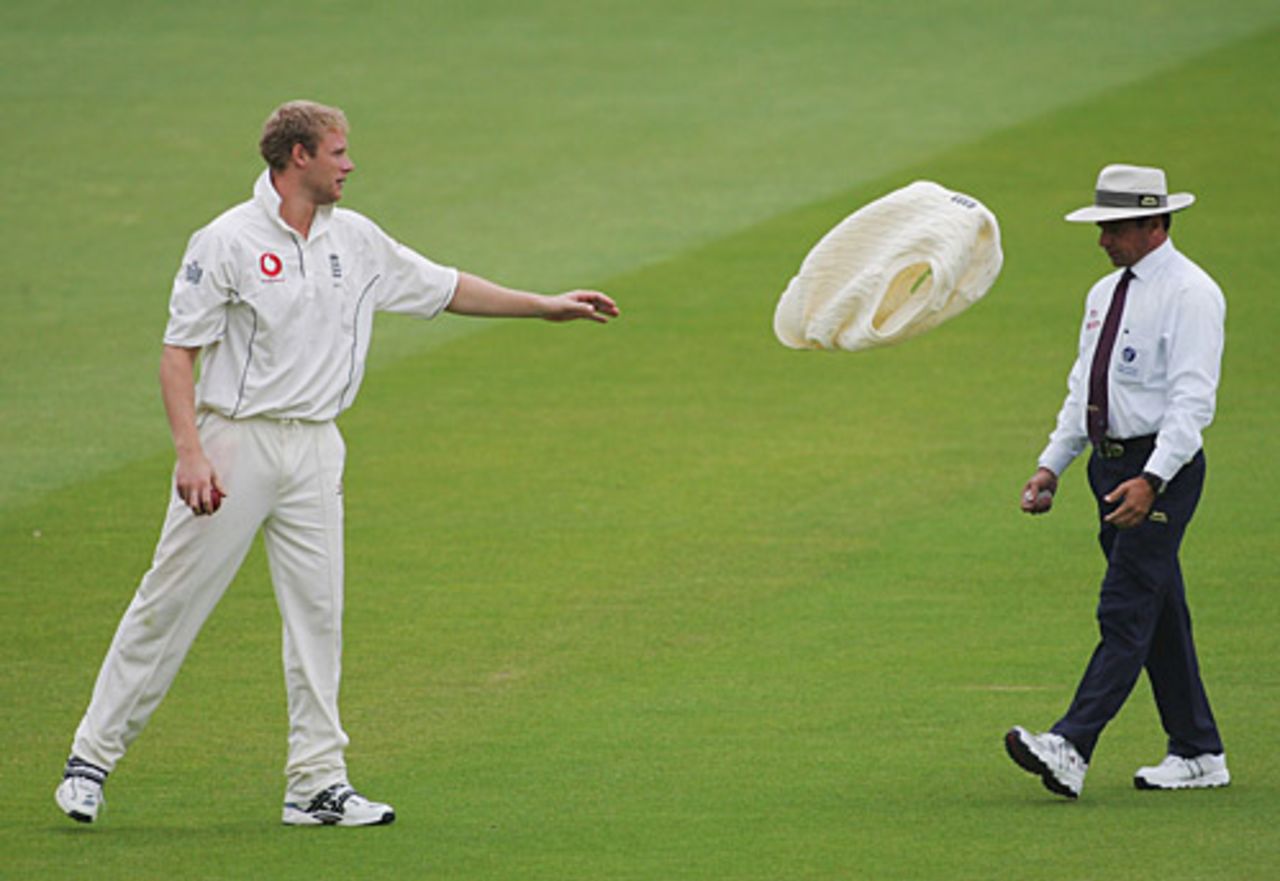 Andrew Flintoff tosses his jumper to the umpire Aleem Dar, England v Sri Lanka, 1st Test, Lord's, May 14, 2006