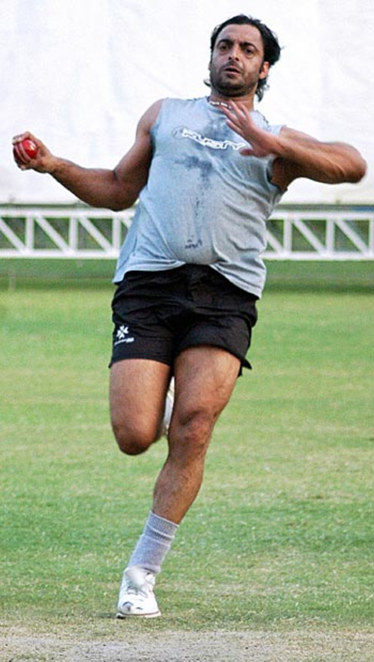 Shoaib Akhtar roars into bowl during a training session, National Cricket Academy, Lahore, May 16, 2006
