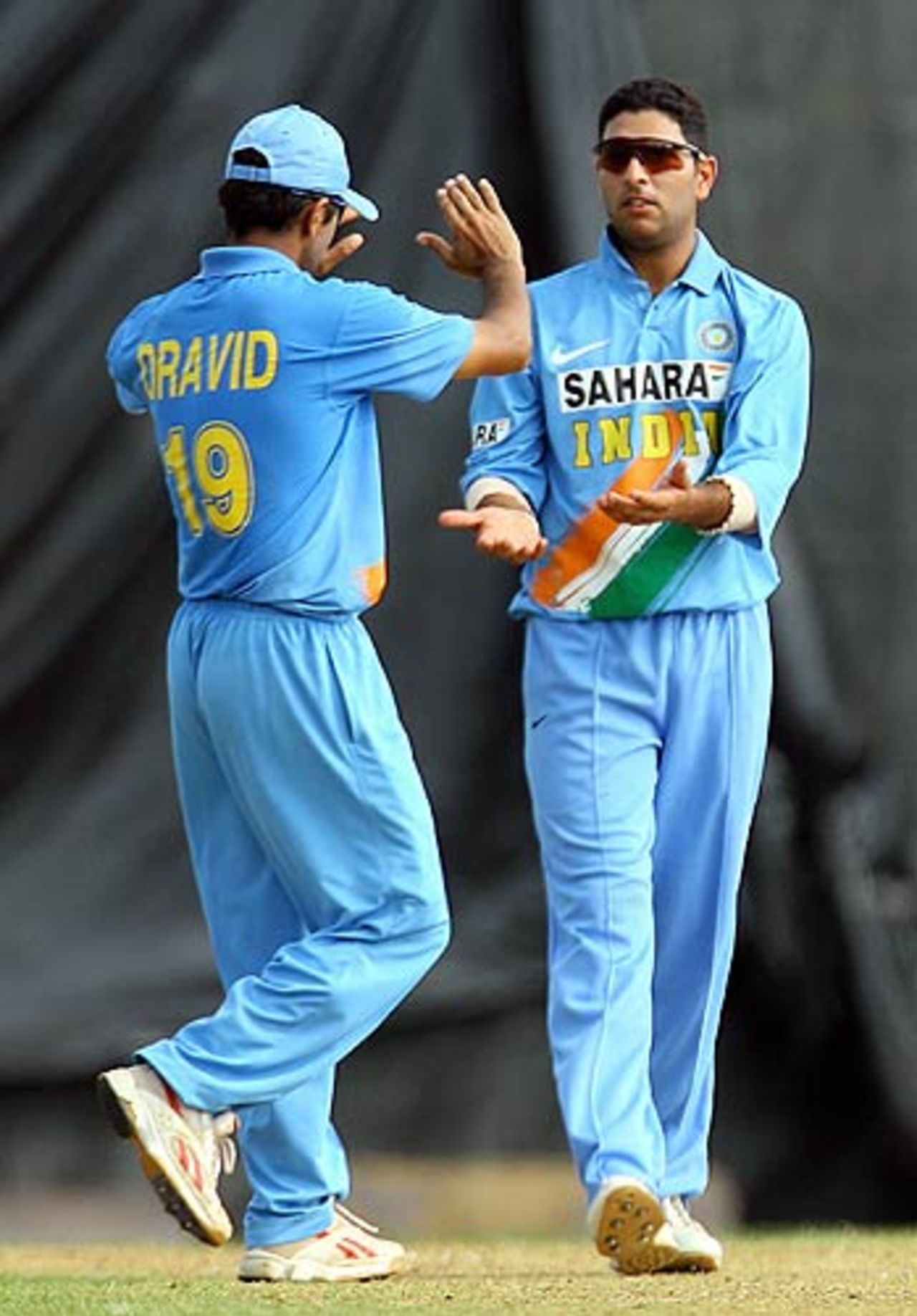 Rahul Dravid congratulates Yuvraj Singh on the wicket of Donovan Sinclair, Jamaica v Indians, Montego Bay, May 16, 2006