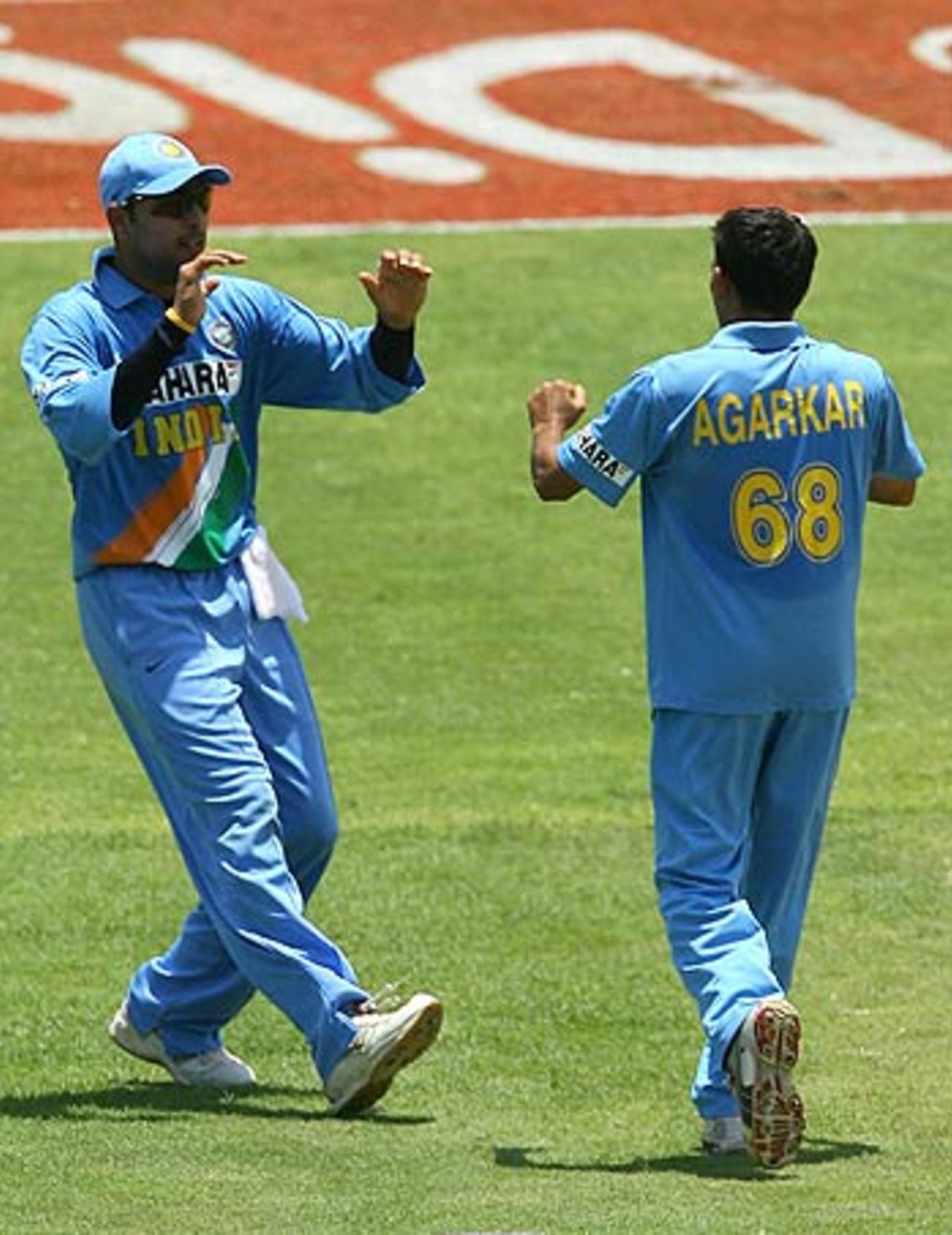 Yuvraj Singh rushes in to congratulate Ajit Agarkar on the wicket of Runako Morton, West Indies v India, 1st ODI, Kingston, May 18, 2006